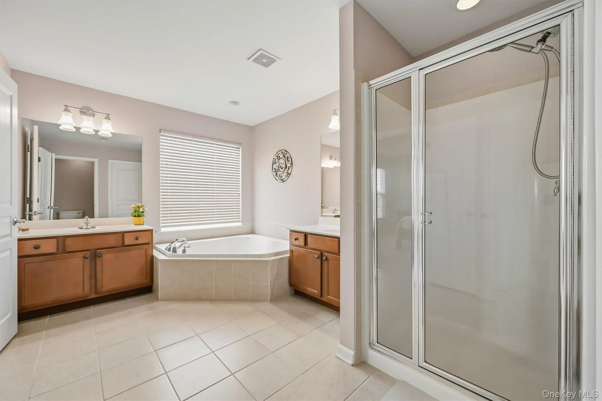 There are two separate vanities and a stand alone shower. There are two separate vanities and a stand alone shower.