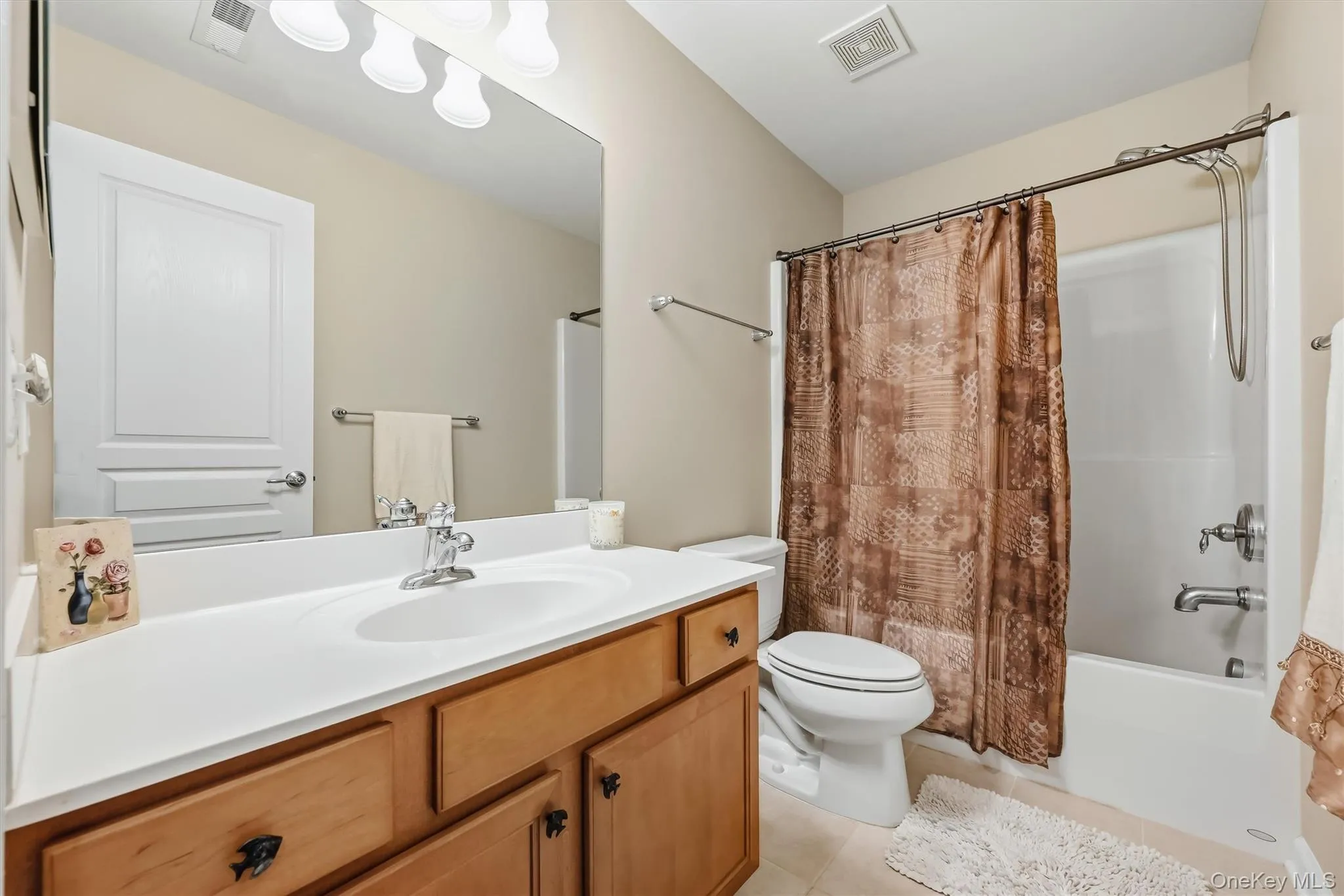 The guest bathroom offers a shower/tub and tiled floors. The guest bathroom offers a shower/tub and tiled floors.