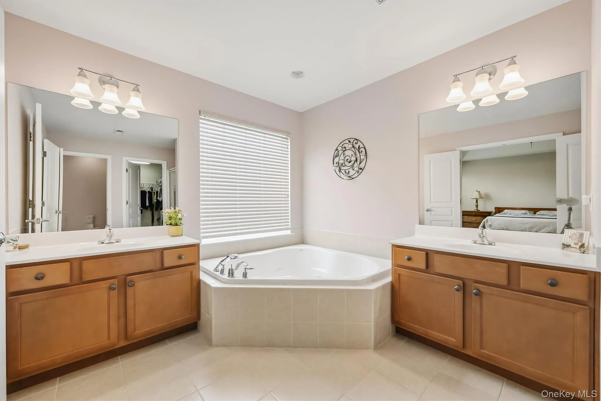 A long hot soak in your jetted corner tub with its large window would be a great way to end a busy day. A long hot soak in your jetted corner tub with its large window would be a great way to end a busy day.