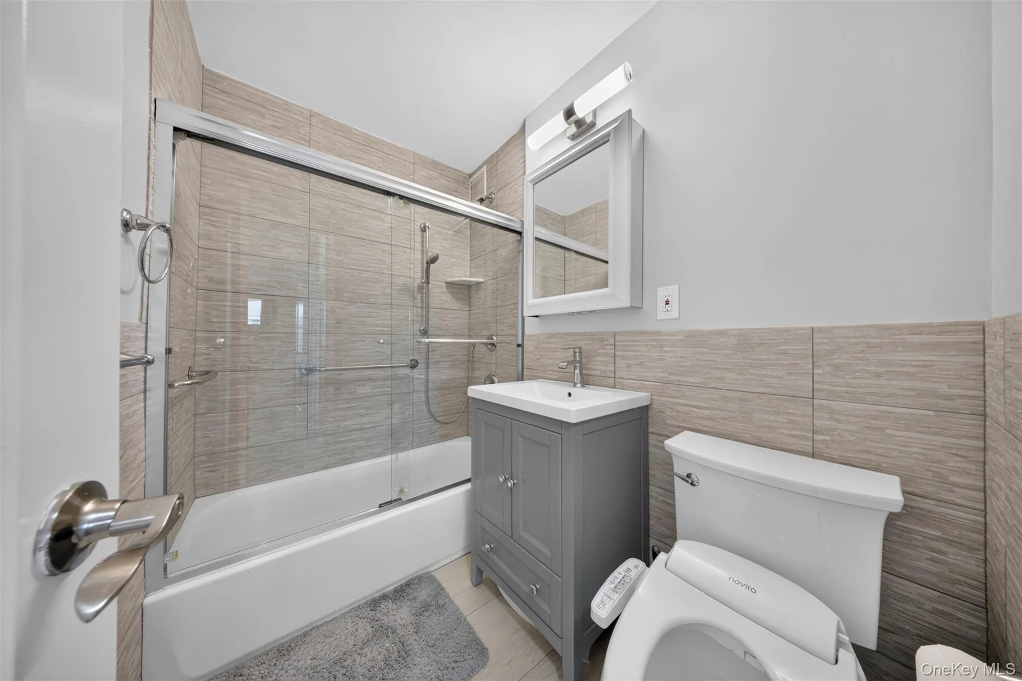 Full bathroom with tub/shower combination, vanity storage, and bidet Full bathroom with tub/shower combination, vanity storage, and bidet