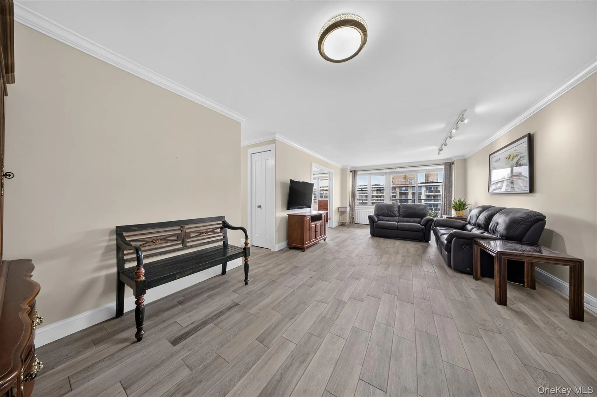 Dining area off the living room features wood-look tile flooring, offering a stylish, easy-care space for everyday meals or entertaining. Dining area off the living room features wood-look tile flooring, offering a stylish, easy-care space for everyday meals or entertaining.
