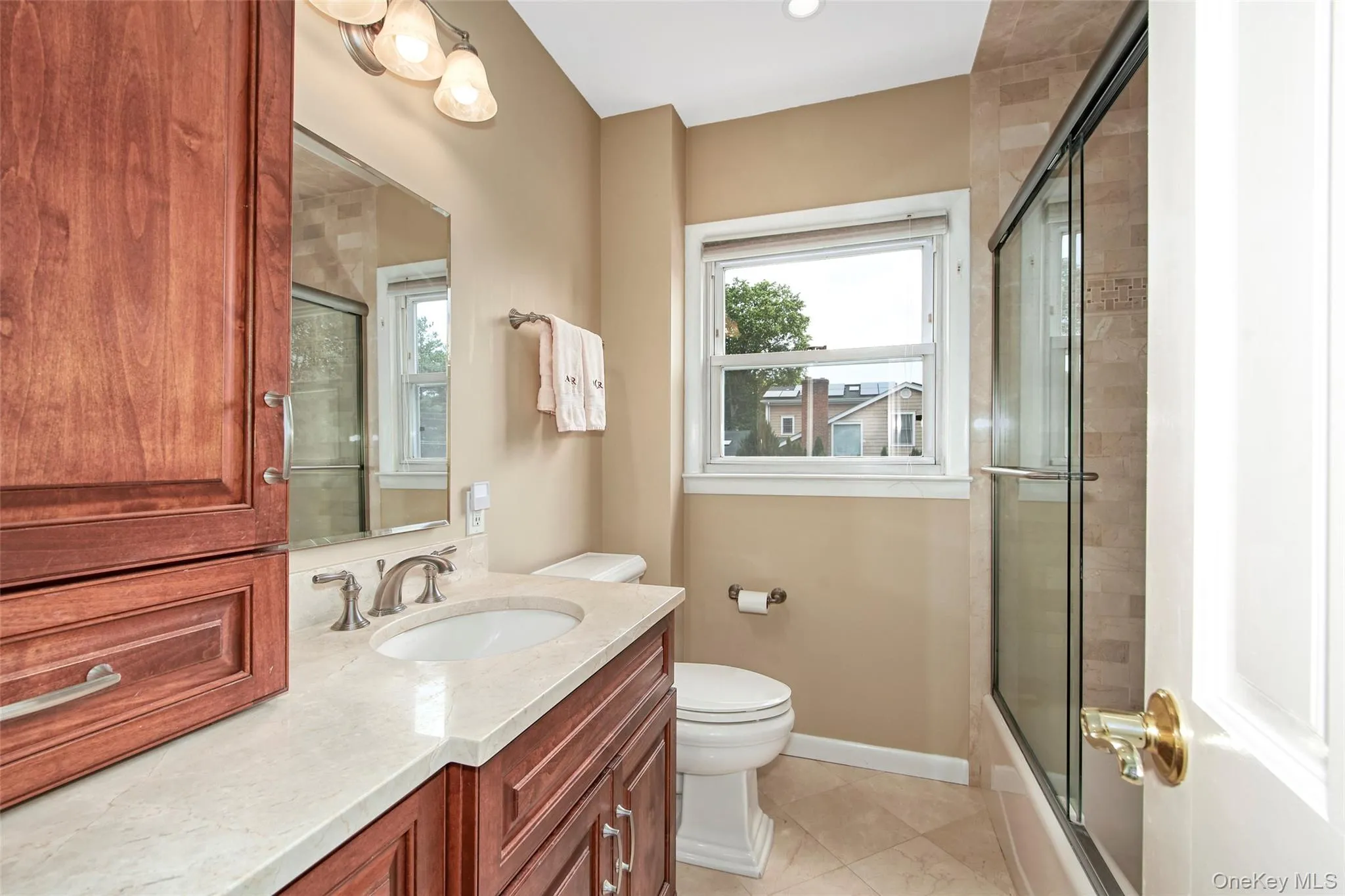 Bright, updated full bathroom with tub and shower Bright, updated full bathroom with tub and shower