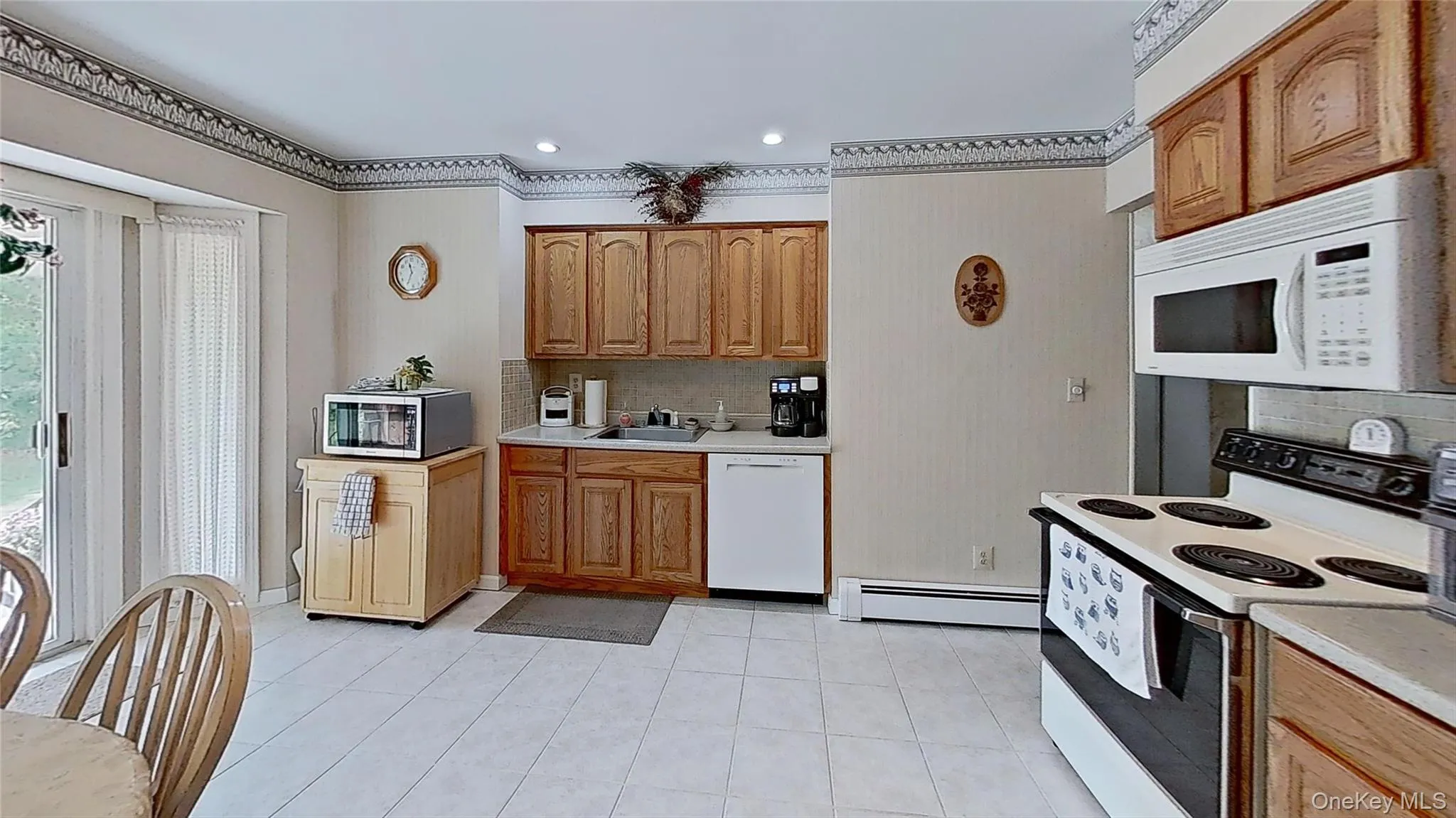 The Kitchen is spacious and very functional…with great seasonal views! The Kitchen is spacious and very functional…with great seasonal views!