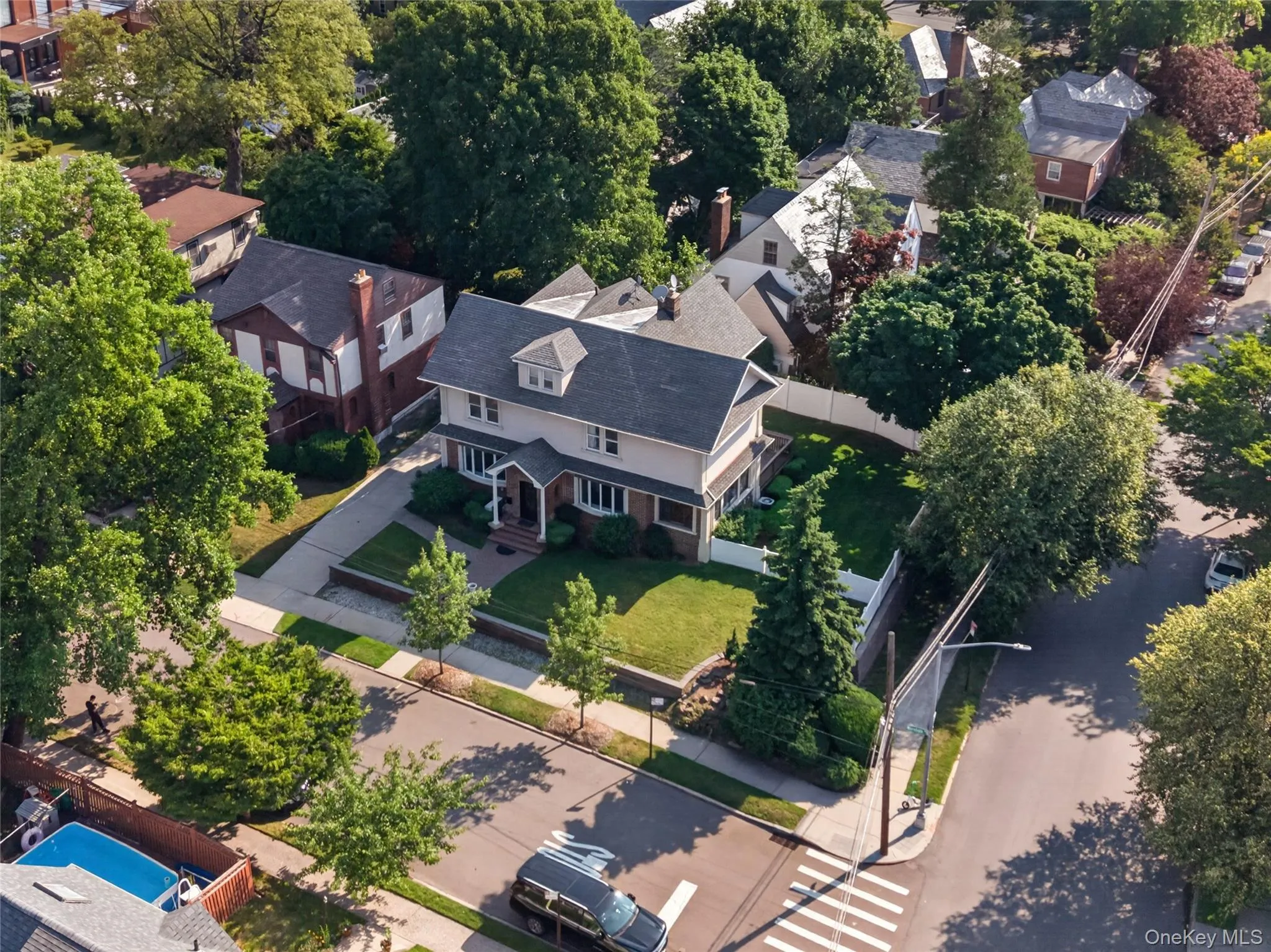 Two-story residence featuring a gabled roof and covered front porch Two-story residence featuring a gabled roof and covered front porch