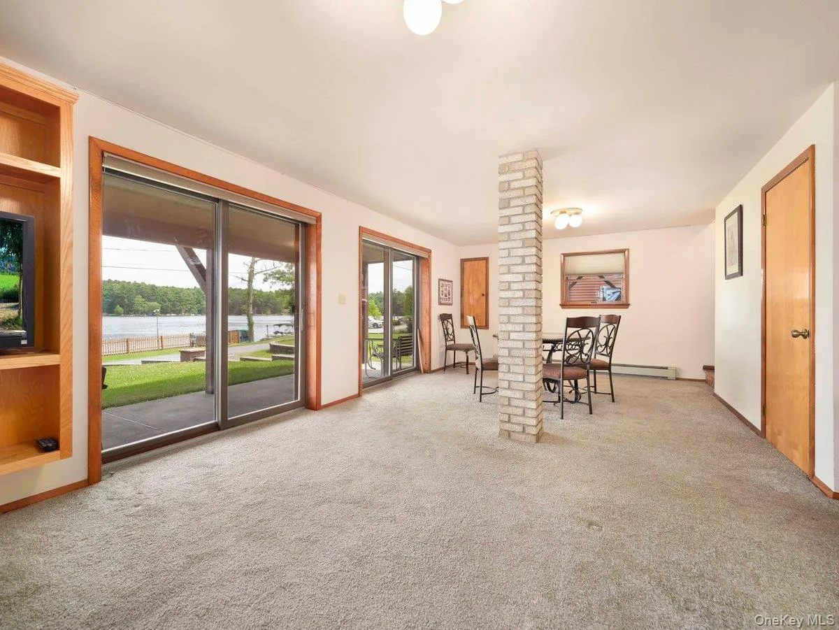 Lower level with sliding doors and view of Mohican Lake Lower level with sliding doors and view of Mohican Lake