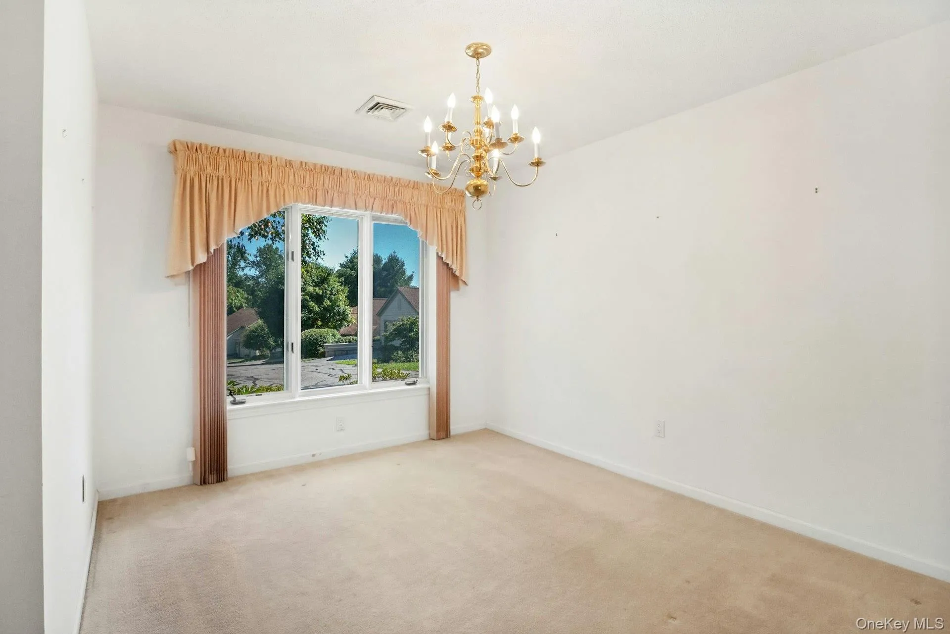 Separate dining room with chandelier included Separate dining room with chandelier included