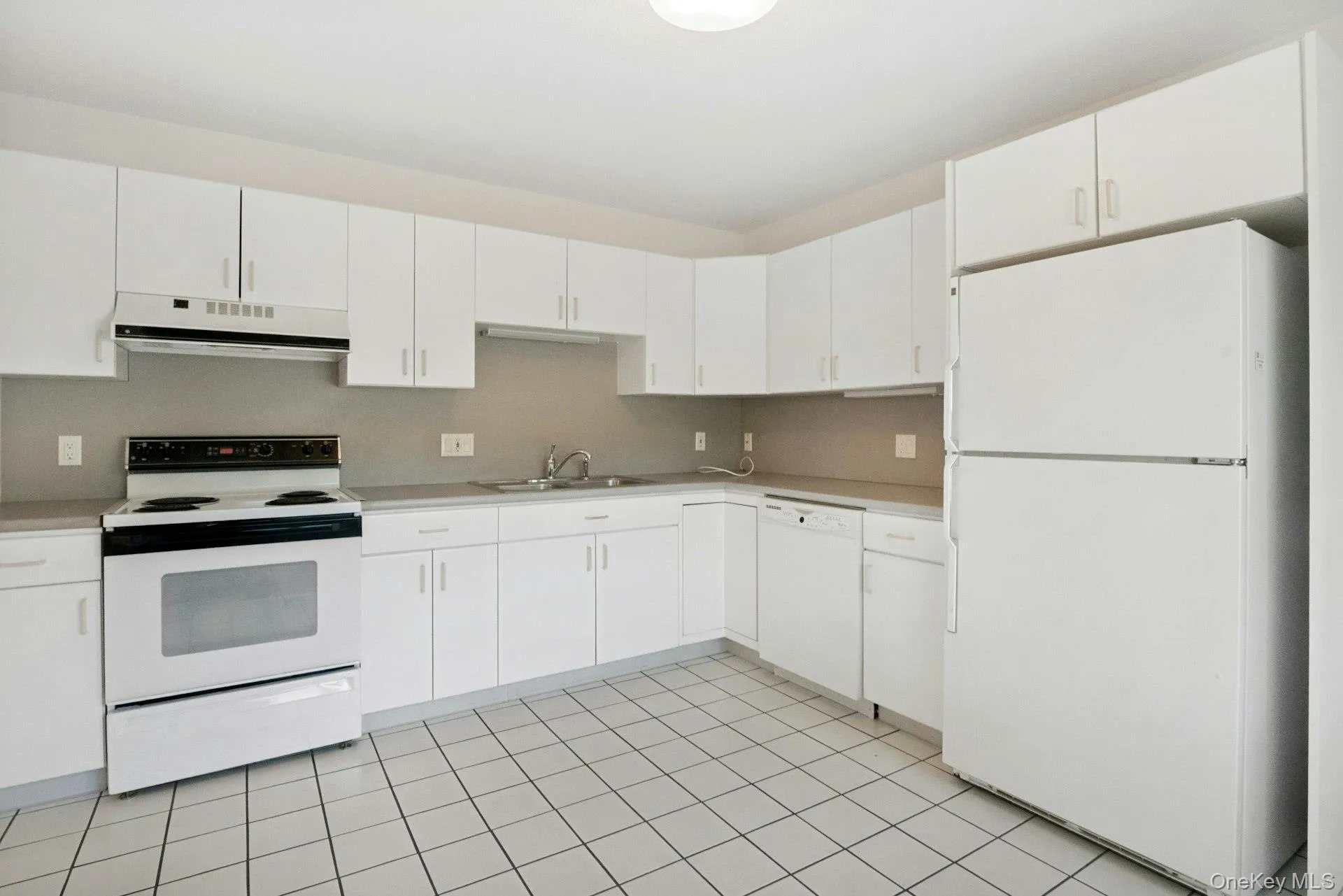 Another view of the kitchen showing ample counter space.To the far left of the oven, is pantry Another view of the kitchen showing ample counter space.To the far left of the oven, is pantry