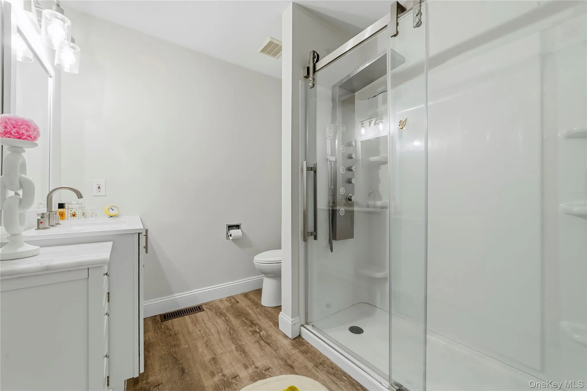 Designer Shower stall with overhead rainfall shower system, modern styled sliding glass doors and built in shelving. Designer Shower stall with overhead rainfall shower system, modern styled sliding glass doors and built in shelving.