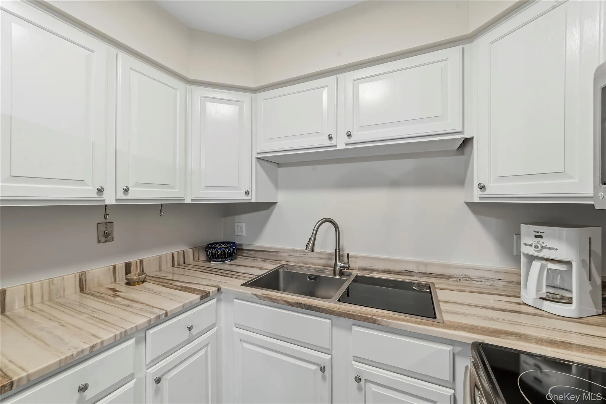 White custom cabinetry all like new with pewter knobs. White custom cabinetry all like new with pewter knobs.
