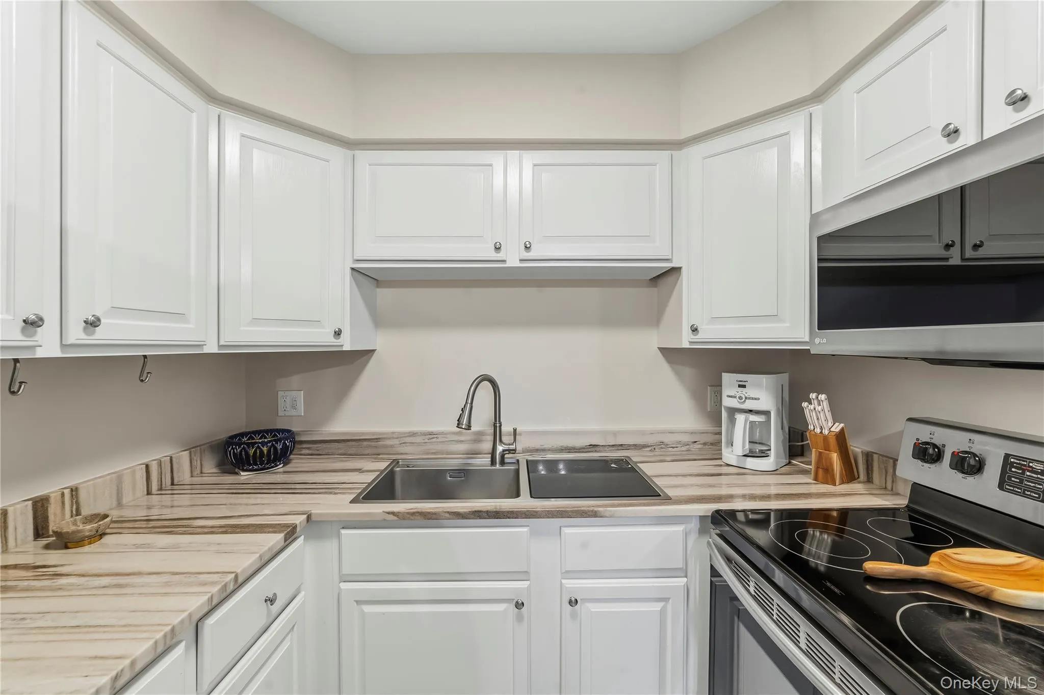 Built in to the counter top custom dishwasher. Built in to the counter top custom dishwasher.