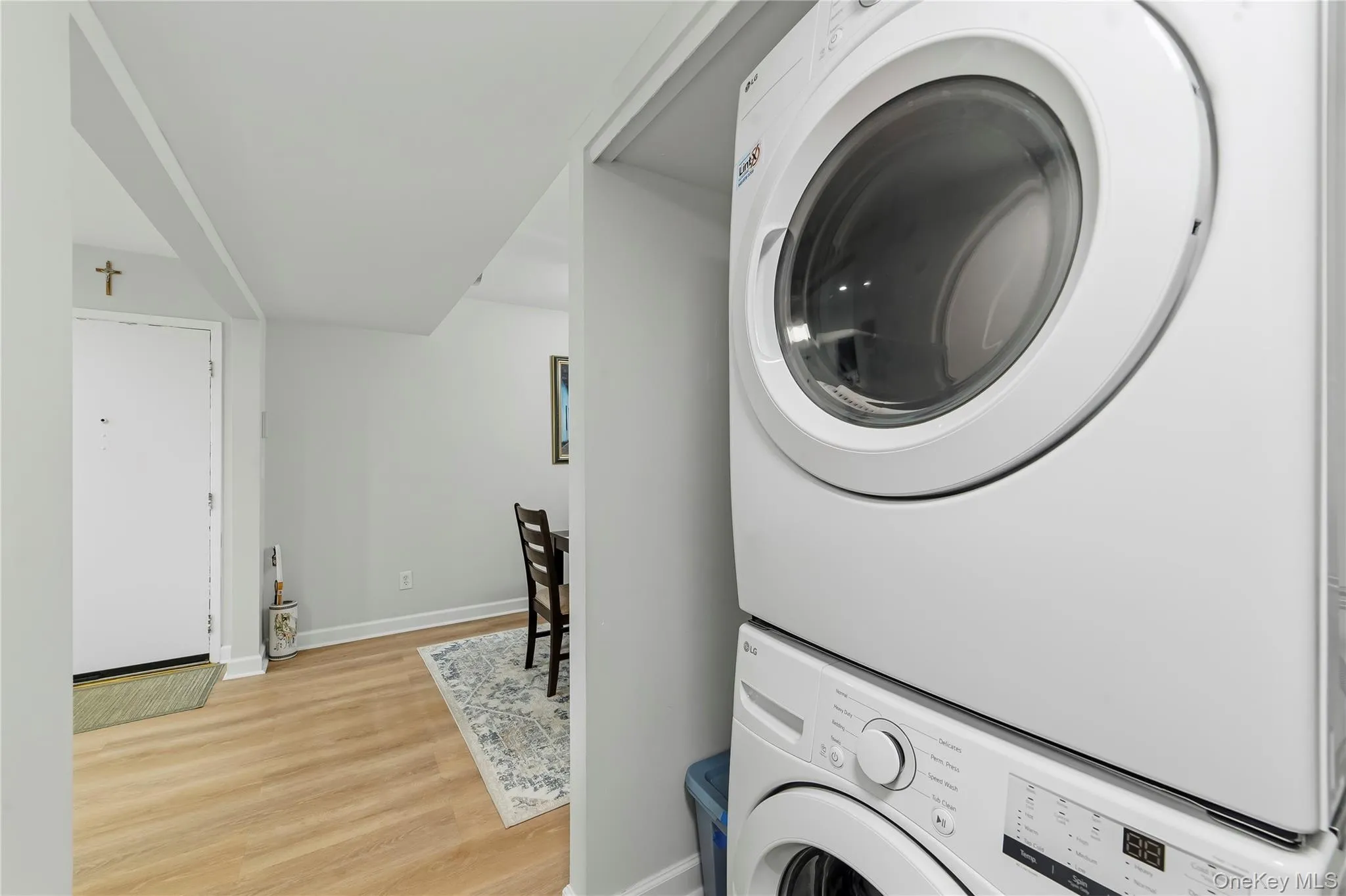 Full size washer and dryer in the hallway of the condo. Full size washer and dryer in the hallway of the condo.
