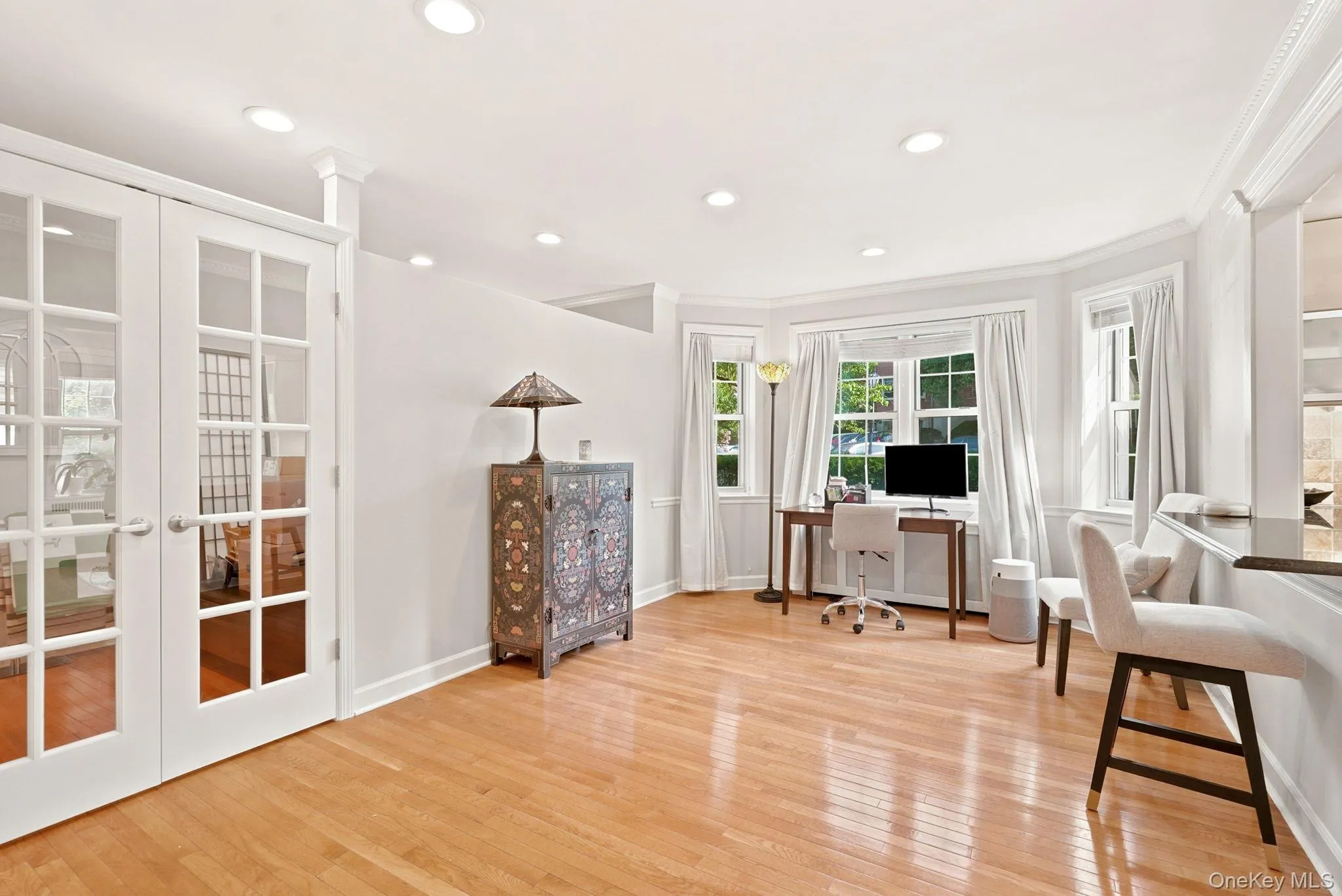Living Room angle shows French doors that lead to the sleeping alcove. Living Room angle shows French doors that lead to the sleeping alcove.