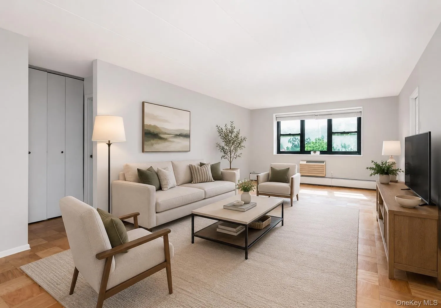 Virtually staged. Bright living area featuring wood-finish parquet flooring, light-colored walls, and a window with natural light Virtually staged. Bright living area featuring wood-finish parquet flooring, light-colored walls, and a window with natural light