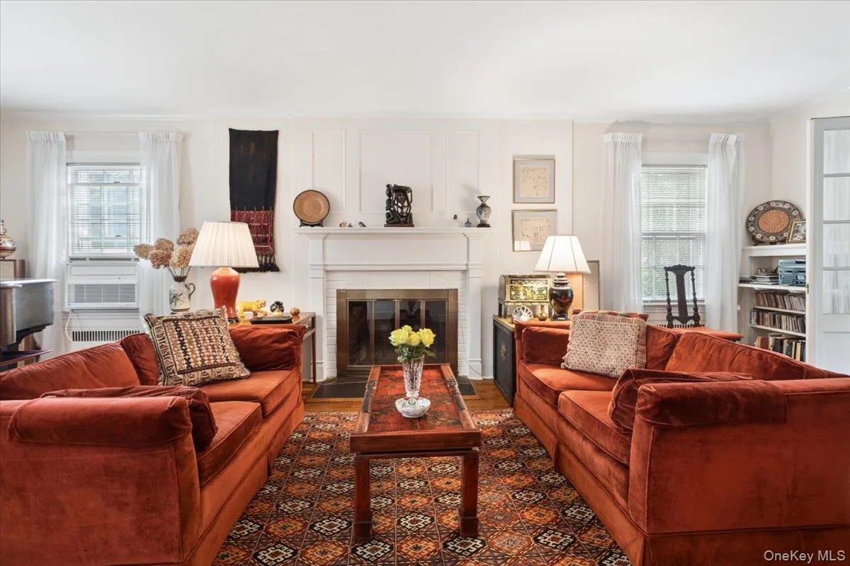 Living Room Offering Comfortable Seating Centered Around a Handsome Fireplace Living Room Offering Comfortable Seating Centered Around a Handsome Fireplace