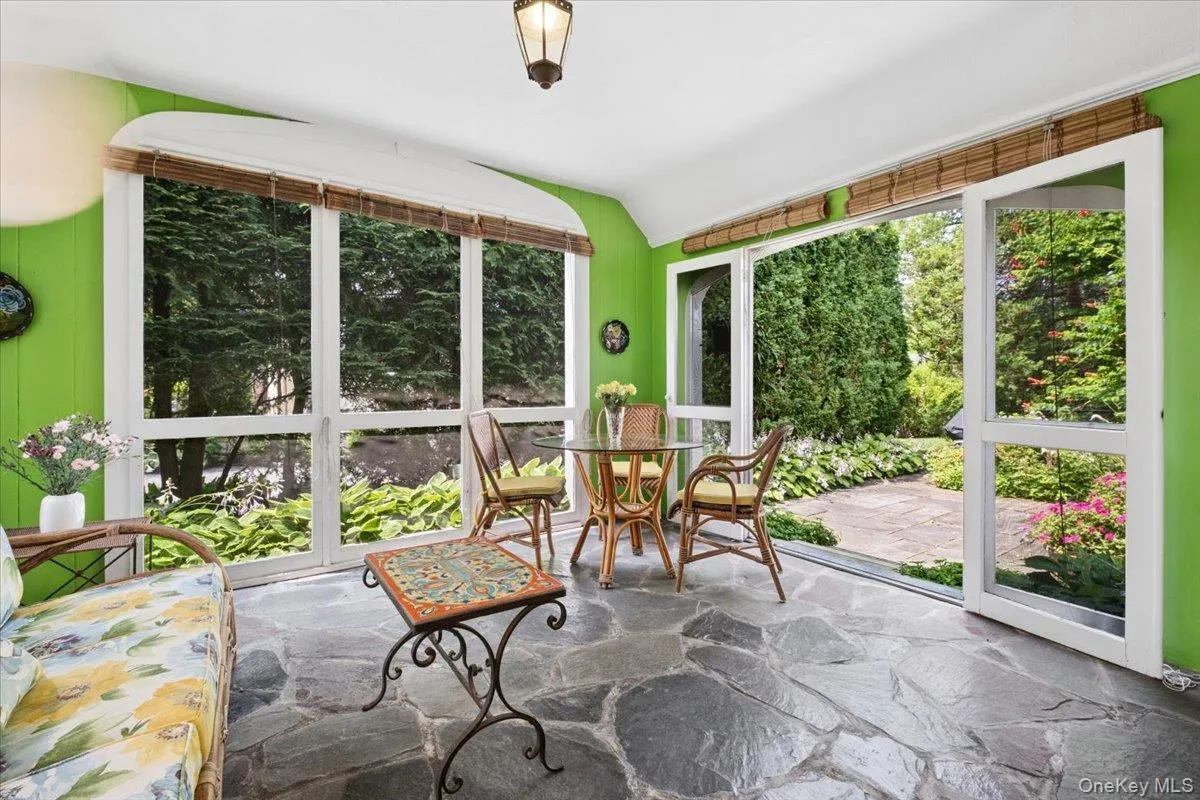 Screened Porch Flows onto a private Patio and Gardens Screened Porch Flows onto a private Patio and Gardens
