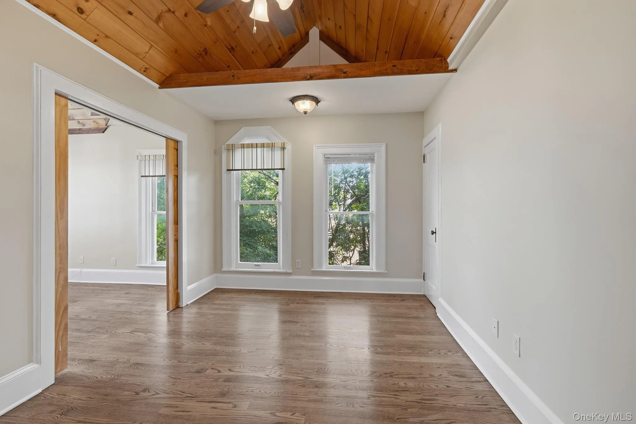Bedroom two features vaulted ceilings, floor to ceiling windows, hardwood floors and plenty of room for everything you need to make this space your own. Bedroom two features vaulted ceilings, floor to ceiling windows, hardwood floors and plenty of room for everything you need to make this space your own.