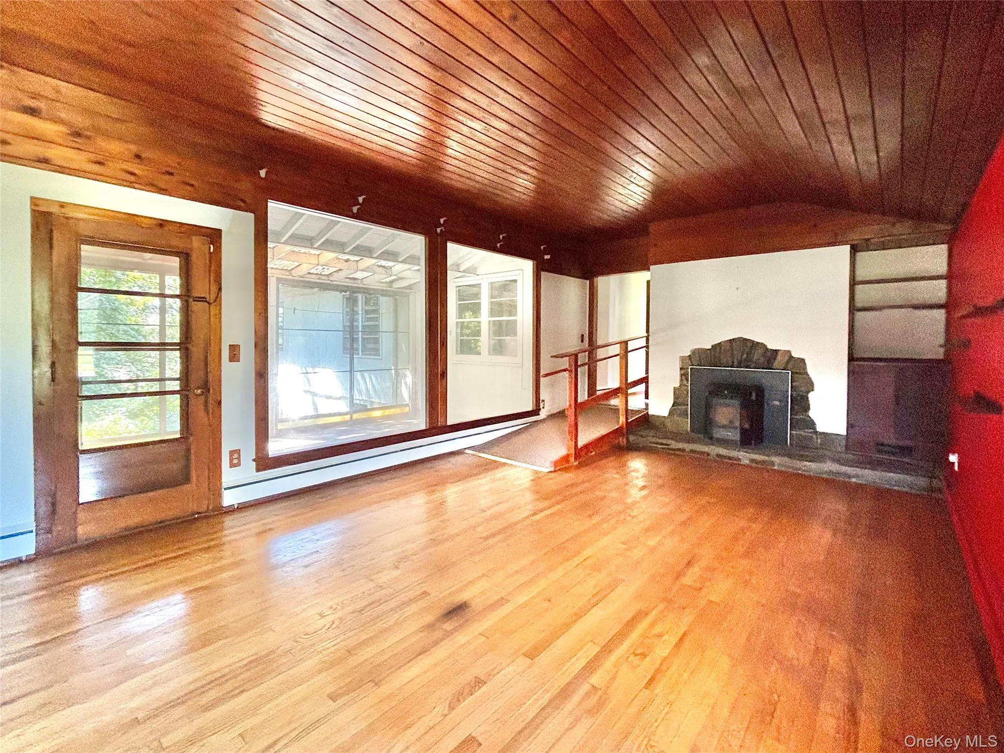 Living Room w fireplace and door to screened porch Living Room w fireplace and door to screened porch