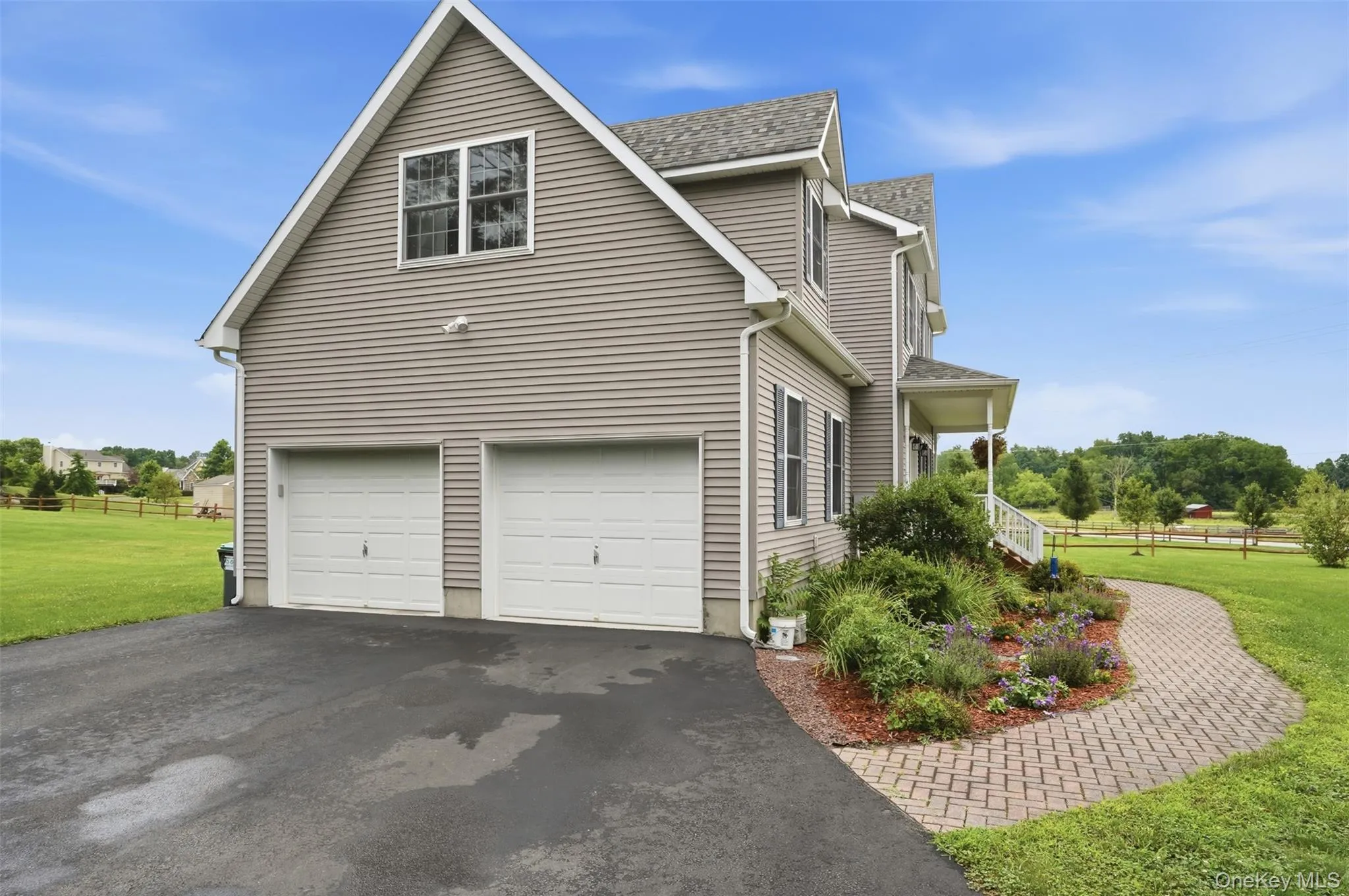 Two-car garage with white paneled doors Two-car garage with white paneled doors