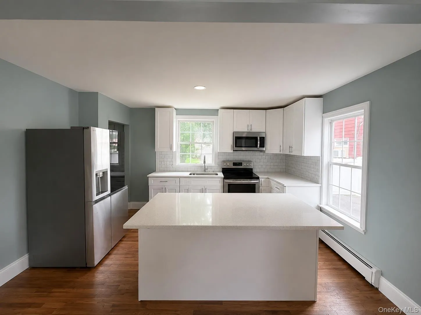 Kitchen with counter top. Access to rear and lower level basement. Kitchen with counter top. Access to rear and lower level basement.