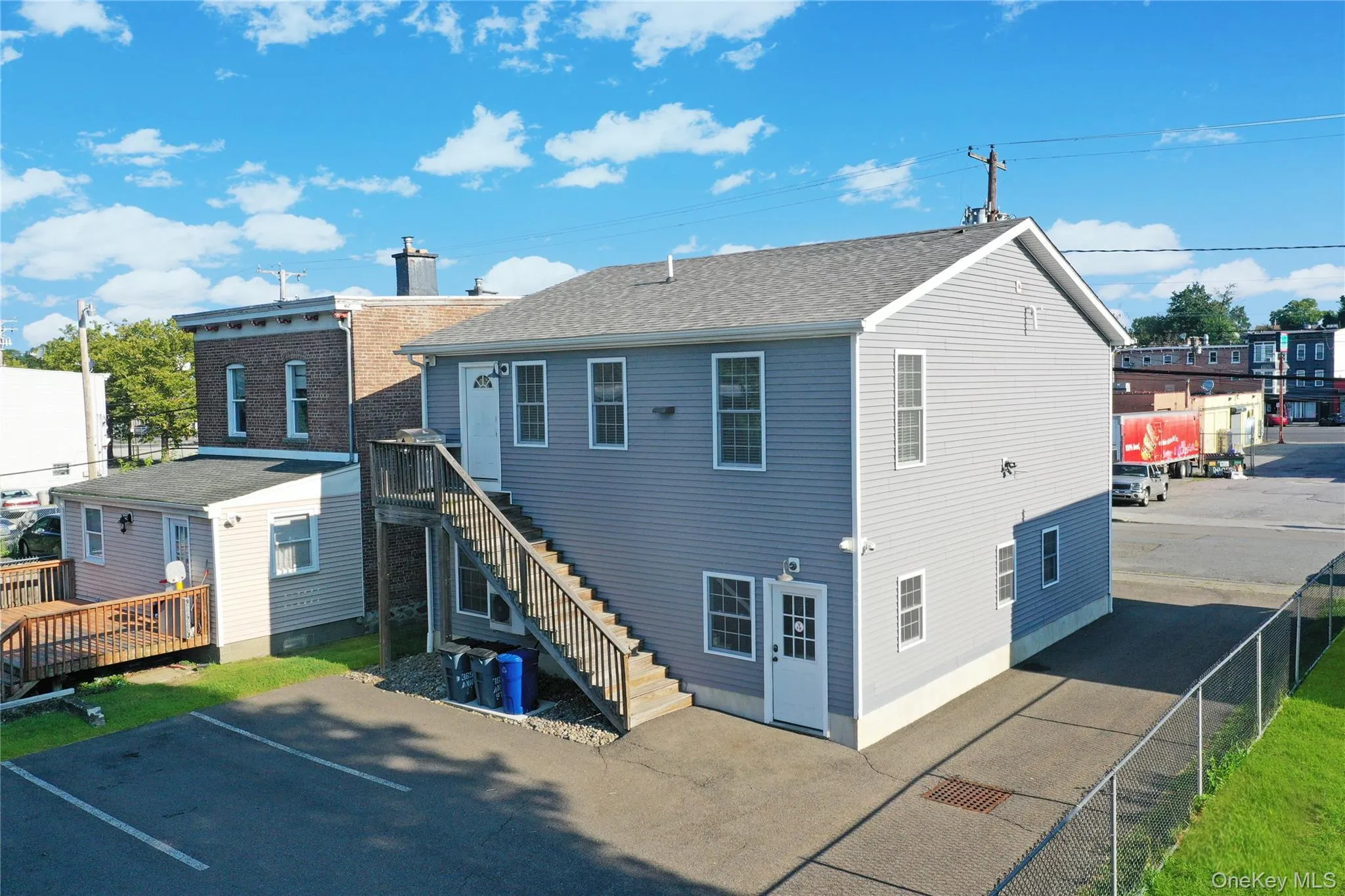 Back of property with a patio area and stairs Back of property with a patio area and stairs