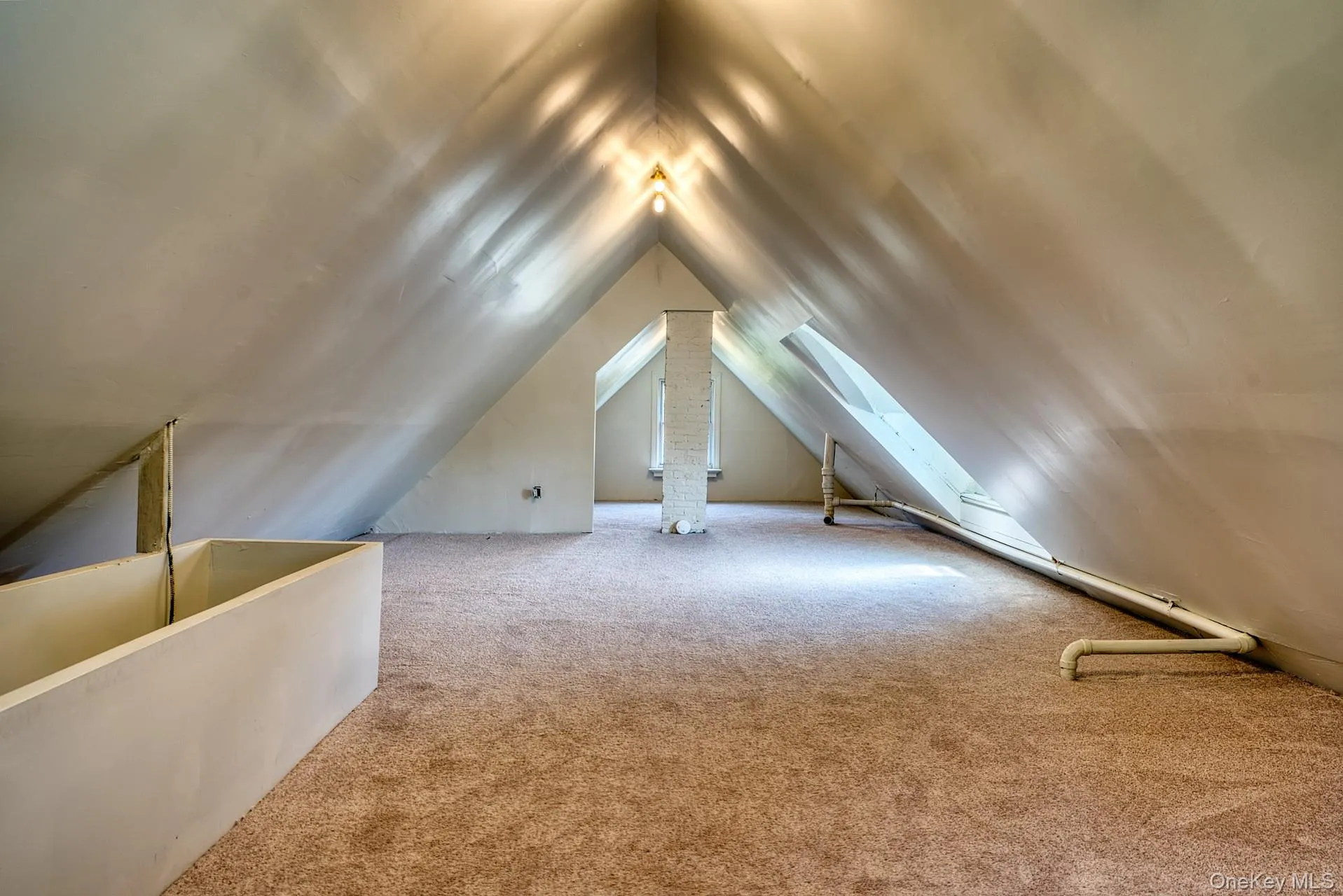 Bonus room with carpet flooring, vaulted ceiling, and a skylight Bonus room with carpet flooring, vaulted ceiling, and a skylight