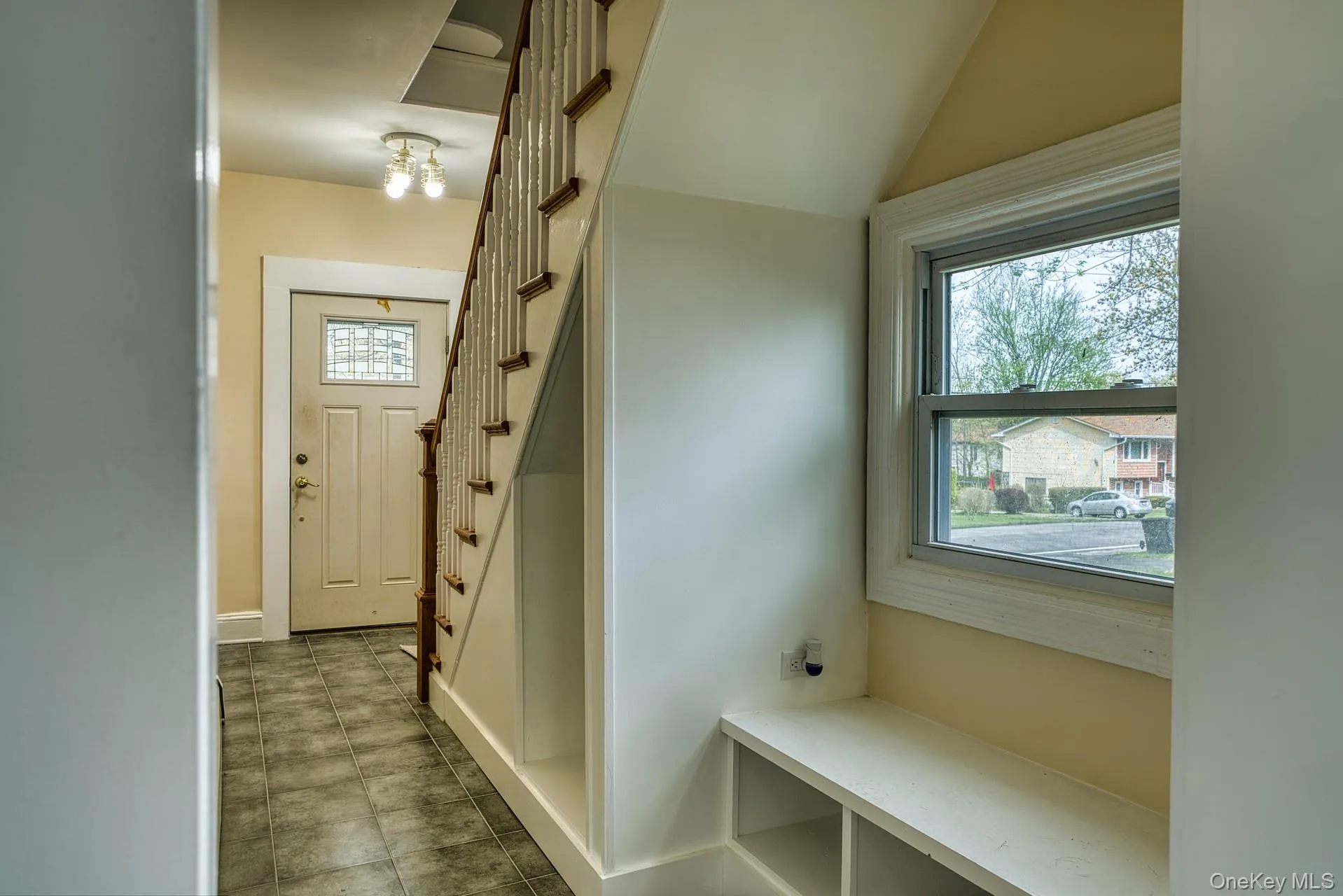 Mudroom featuring lofted ceiling and baseboards Mudroom featuring lofted ceiling and baseboards
