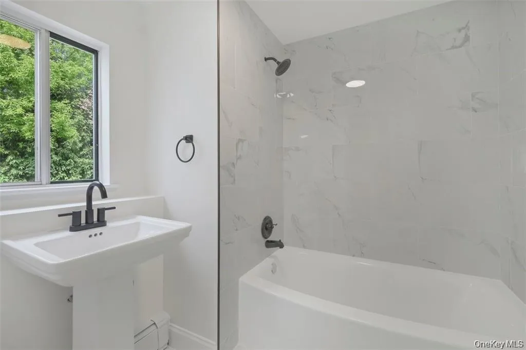 A beautifully refreshed full bathroom offering style, comfort, and convenience for everyday living A beautifully refreshed full bathroom offering style, comfort, and convenience for everyday living