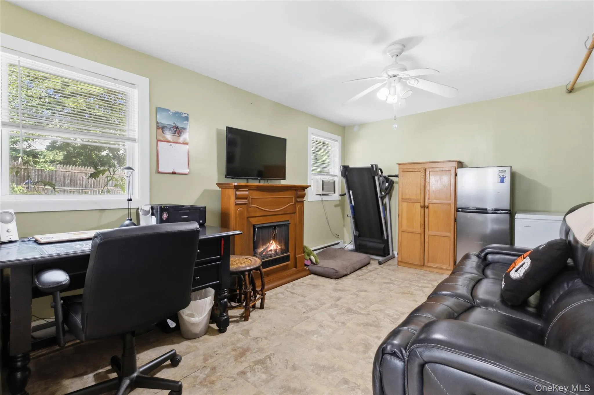 Room off the back entry currently being used as office/ den/ exercise room Room off the back entry currently being used as office/ den/ exercise room