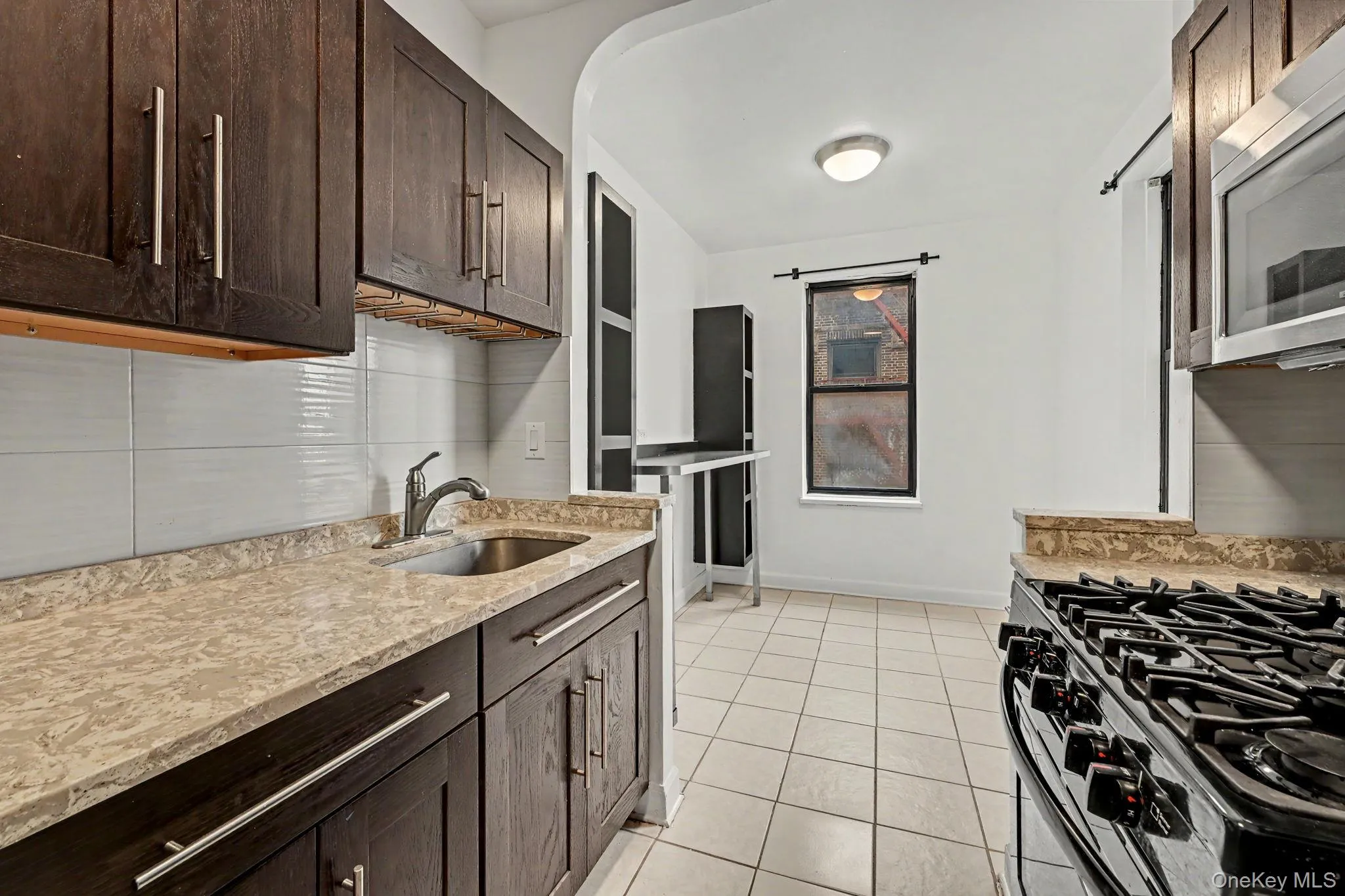 Updated galley kitchen with eat-in breakfast nook. Updated galley kitchen with eat-in breakfast nook.