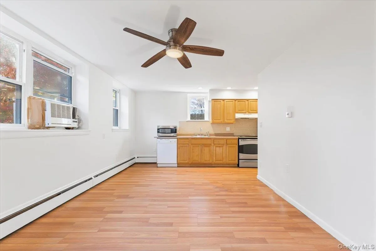 Living room is open to the kitchen. Living room is open to the kitchen.