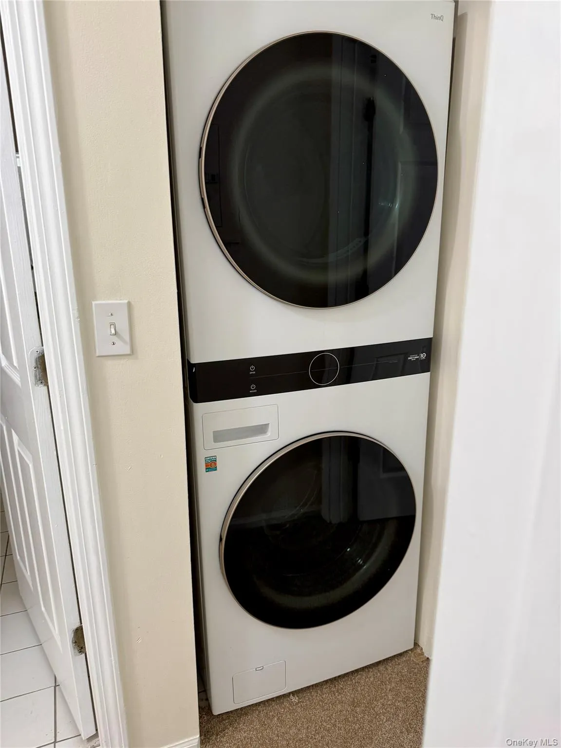Stackable washer and dryer unit with a front-loading design, integrated controls, and a compact footprint Stackable washer and dryer unit with a front-loading design, integrated controls, and a compact footprint