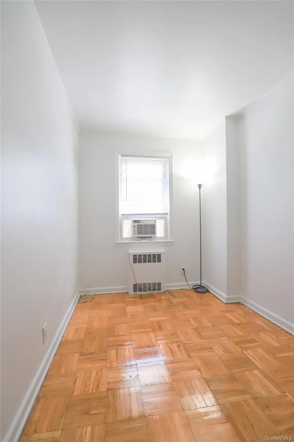 omfortable bedroom with gleaming hardwood floors, built-in closet space, and a bright window omfortable bedroom with gleaming hardwood floors, built-in closet space, and a bright window