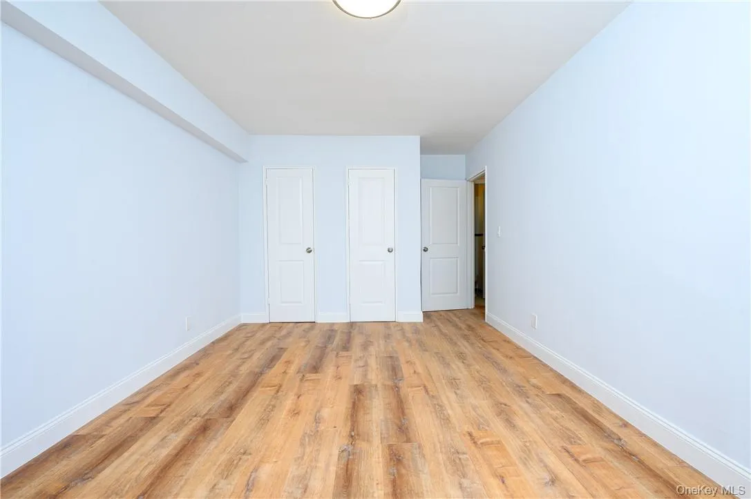 Unfurnished bedroom with light hardwood / wood-style flooring Unfurnished bedroom with light hardwood / wood-style flooring