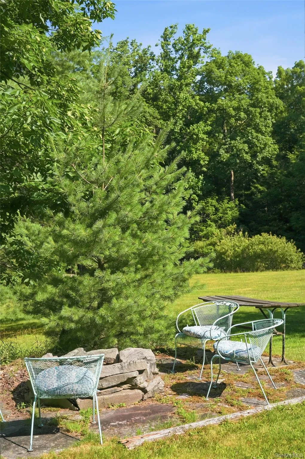 An outdoor firepit, for gathering An outdoor firepit, for gathering