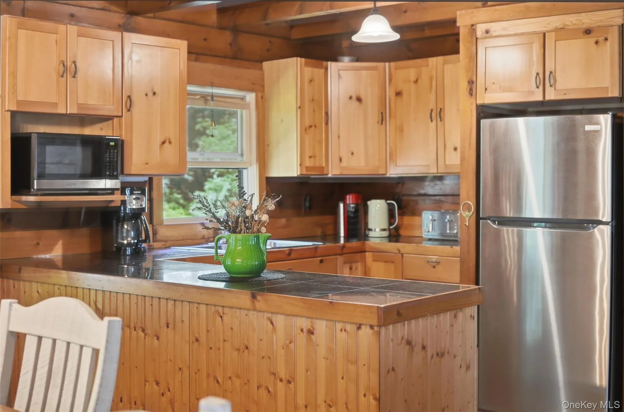 Open kitchen with newer appliances and wood appliances Open kitchen with newer appliances and wood appliances