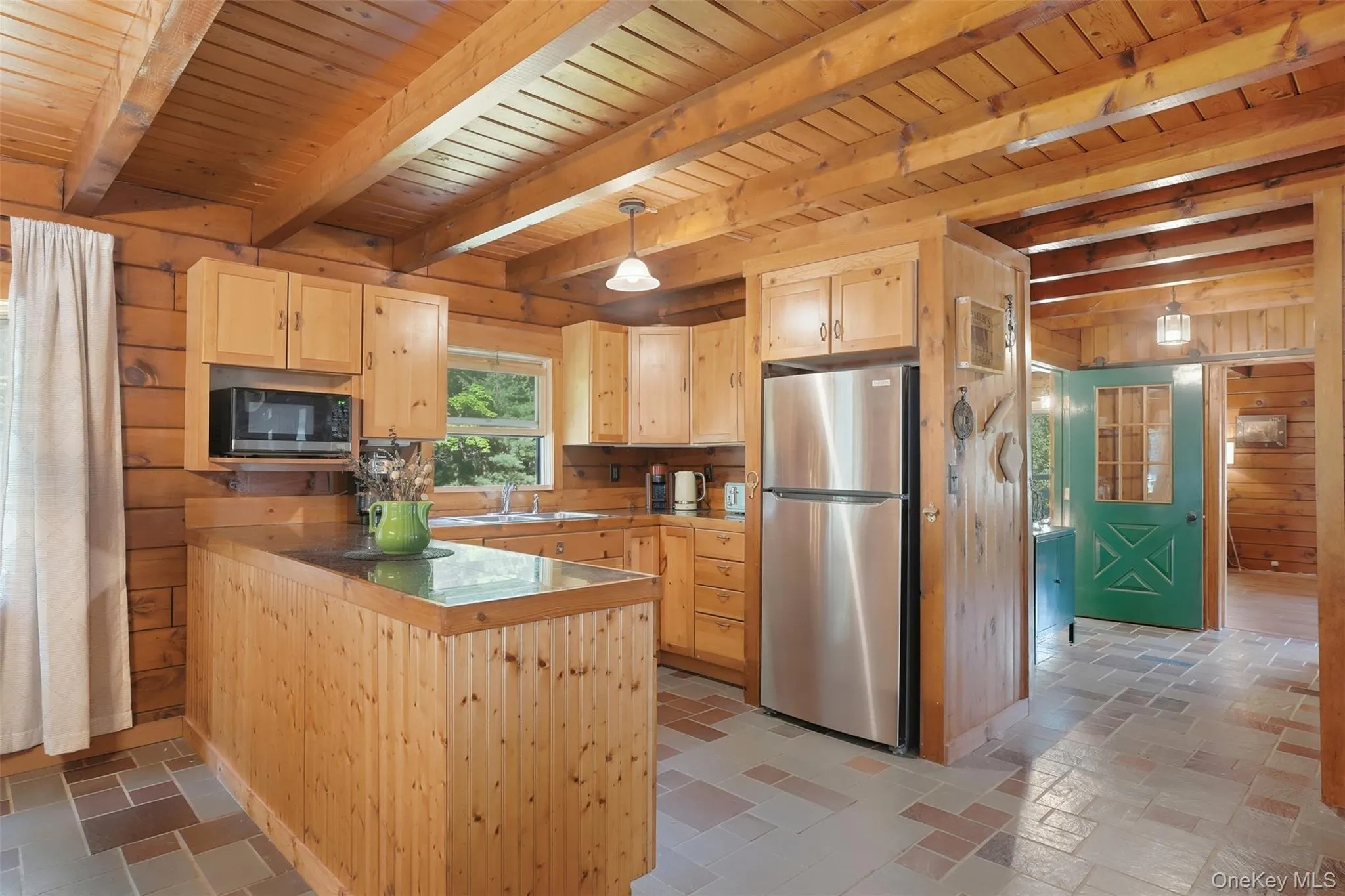 The hallway has additional storage or a pantry and access to the sunroom and back deck for el fresco dining The hallway has additional storage or a pantry and access to the sunroom and back deck for el fresco dining