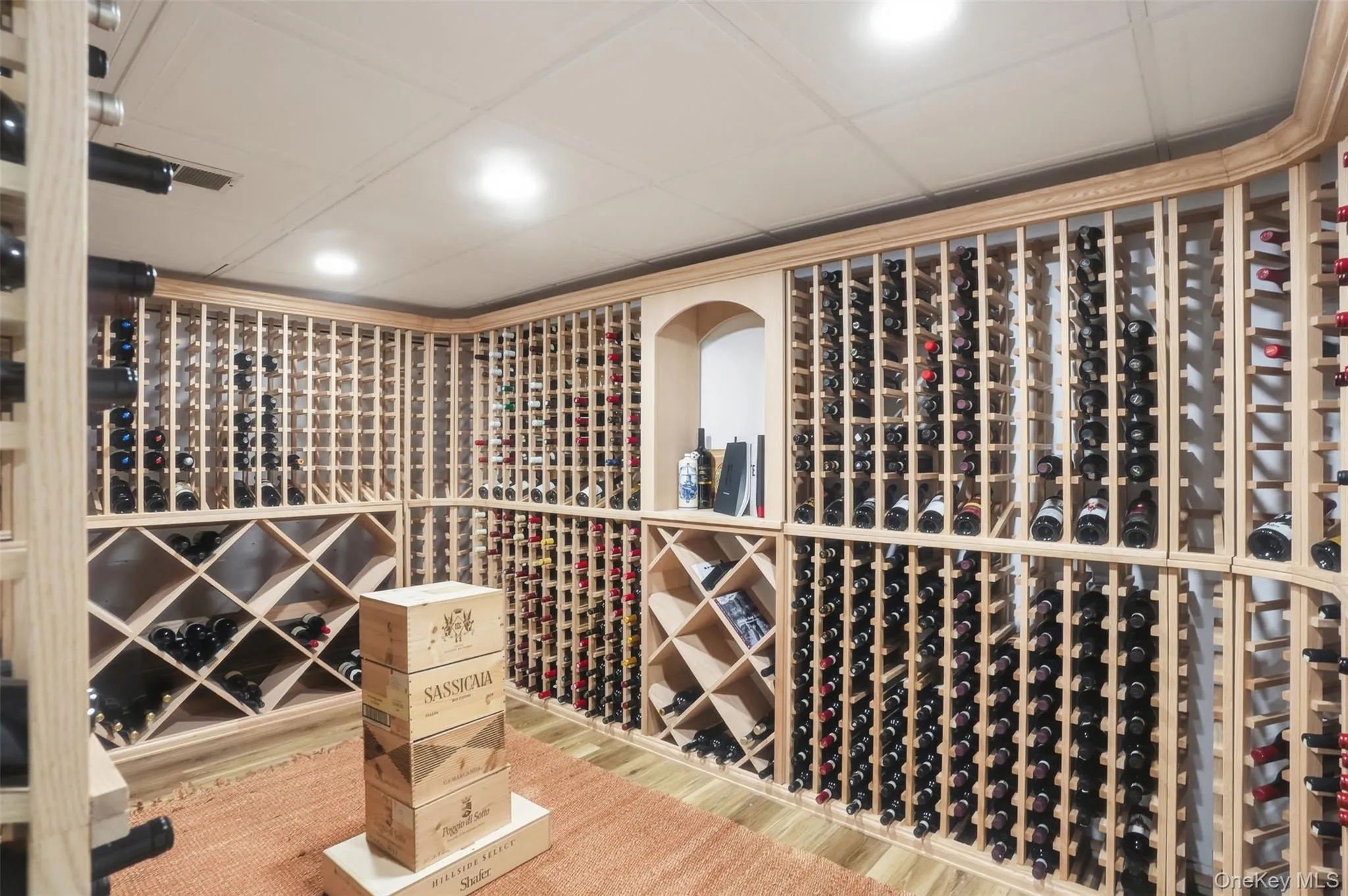 A lovely surprise tucked away like a little secret. The custom wine cellar is ready to store and showcase your collection. A lovely surprise tucked away like a little secret. The custom wine cellar is ready to store and showcase your collection.