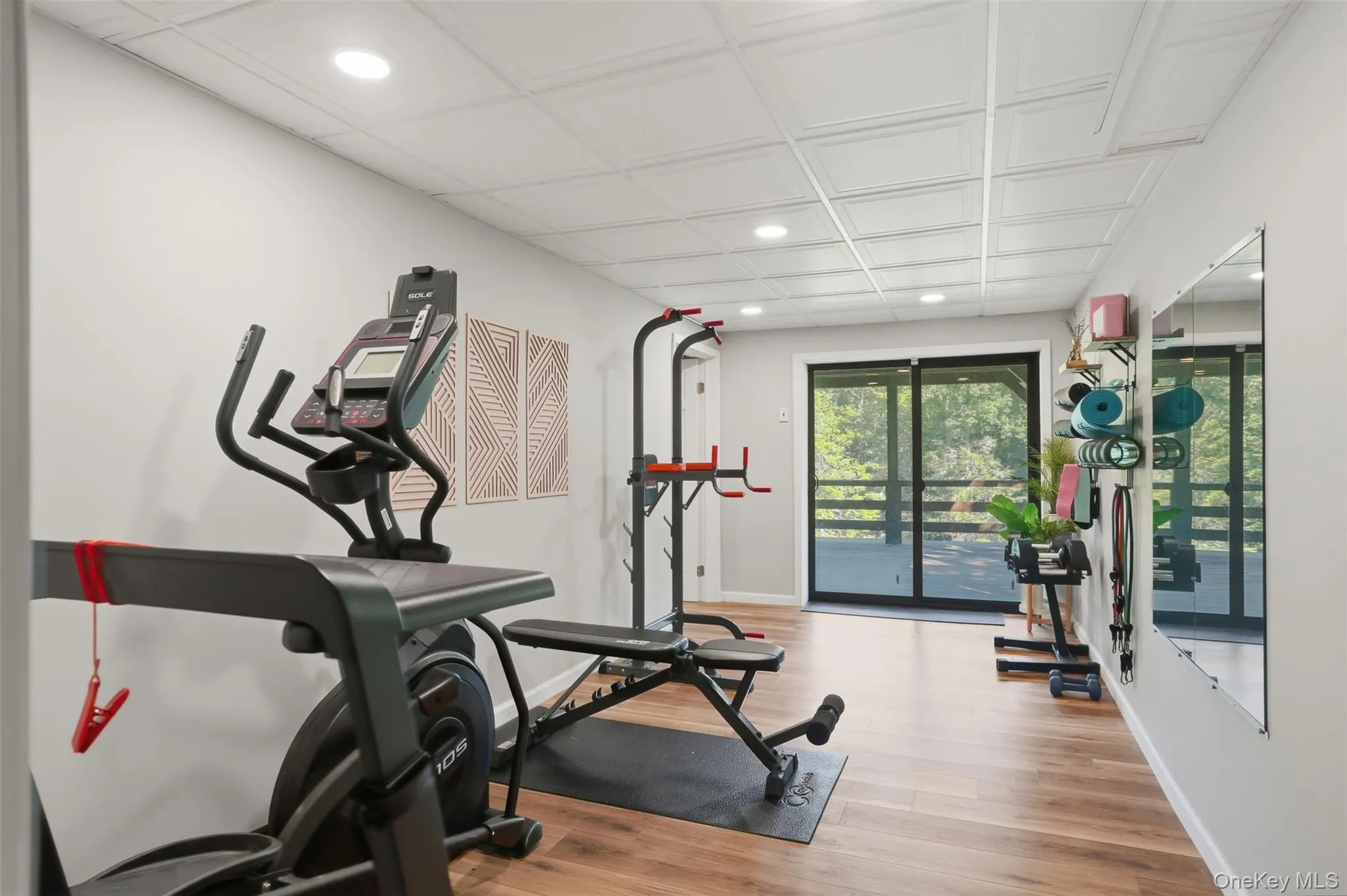 Lower level gym with sliding glass doors to the back deck Lower level gym with sliding glass doors to the back deck