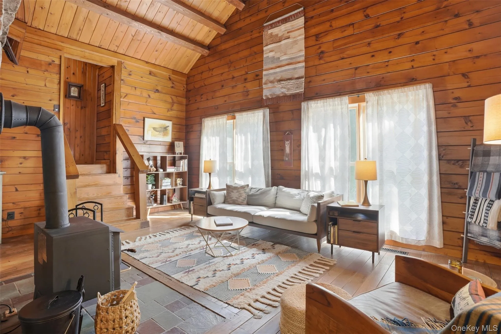 High ceilings, big bright windows, rich hardwood floors and a handsome fireplace make this the heart of the home High ceilings, big bright windows, rich hardwood floors and a handsome fireplace make this the heart of the home