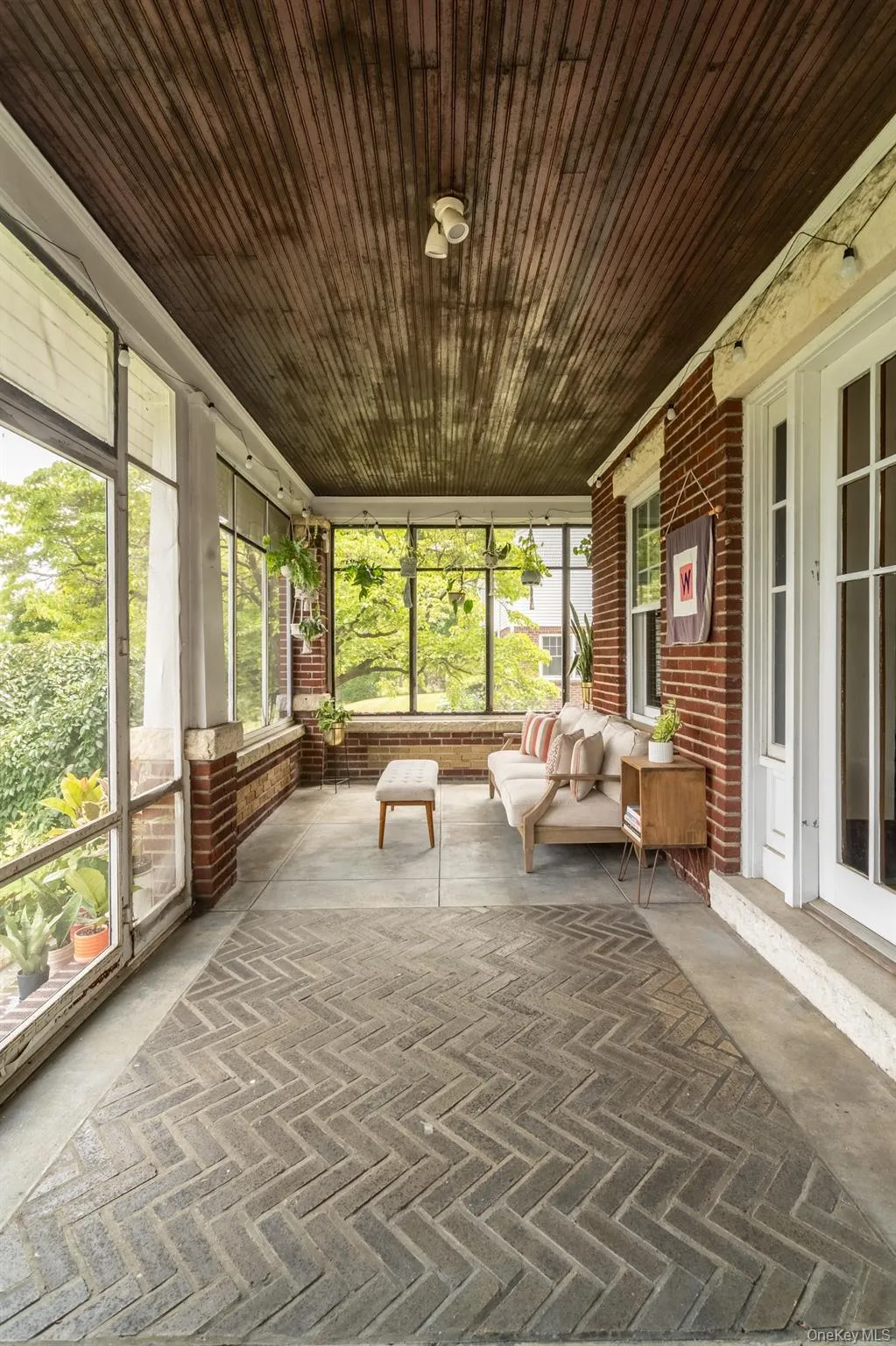 Screen-in porch at front of house. Screen-in porch at front of house.