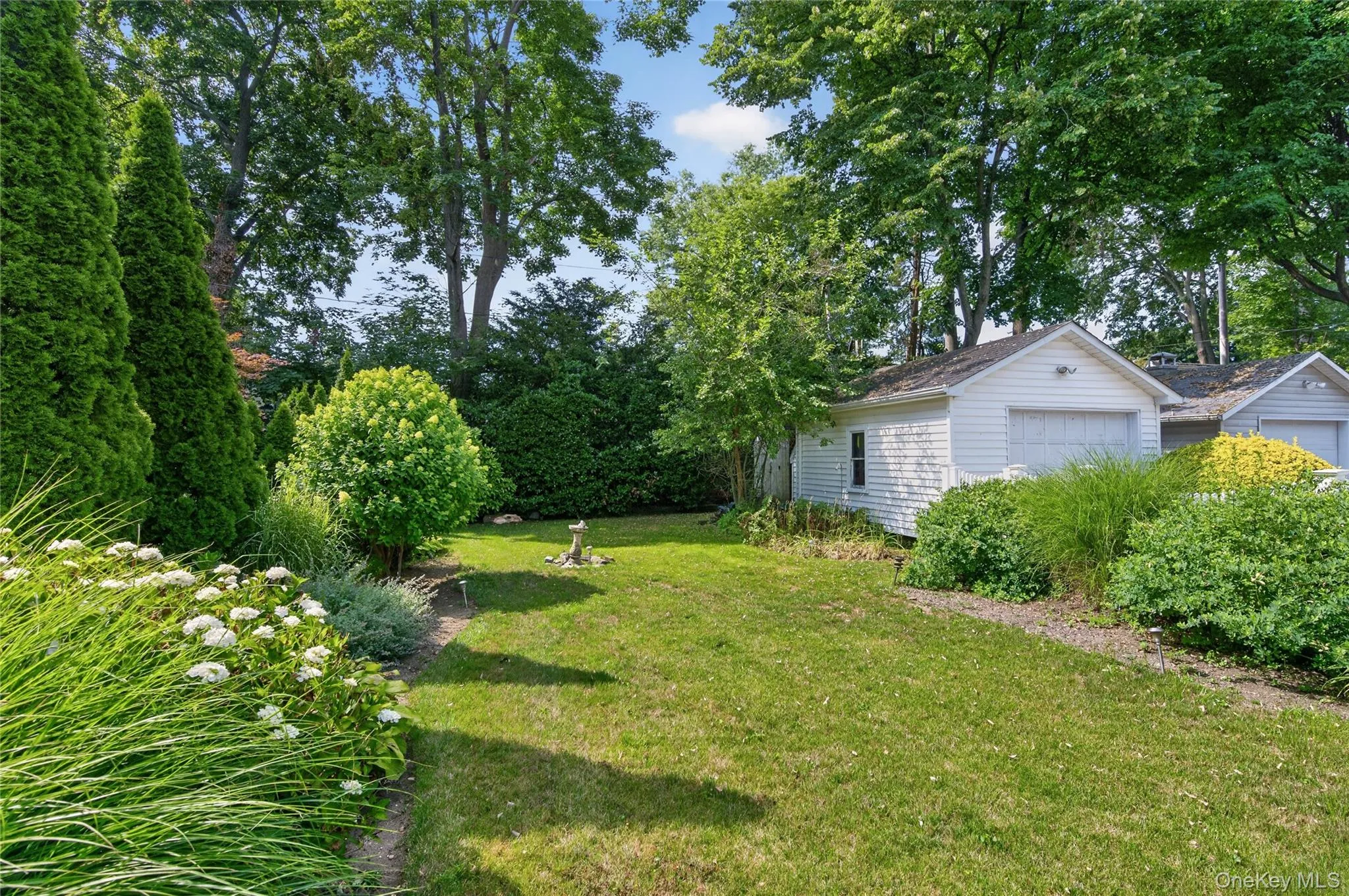 Backyard and 1-car garage Backyard and 1-car garage