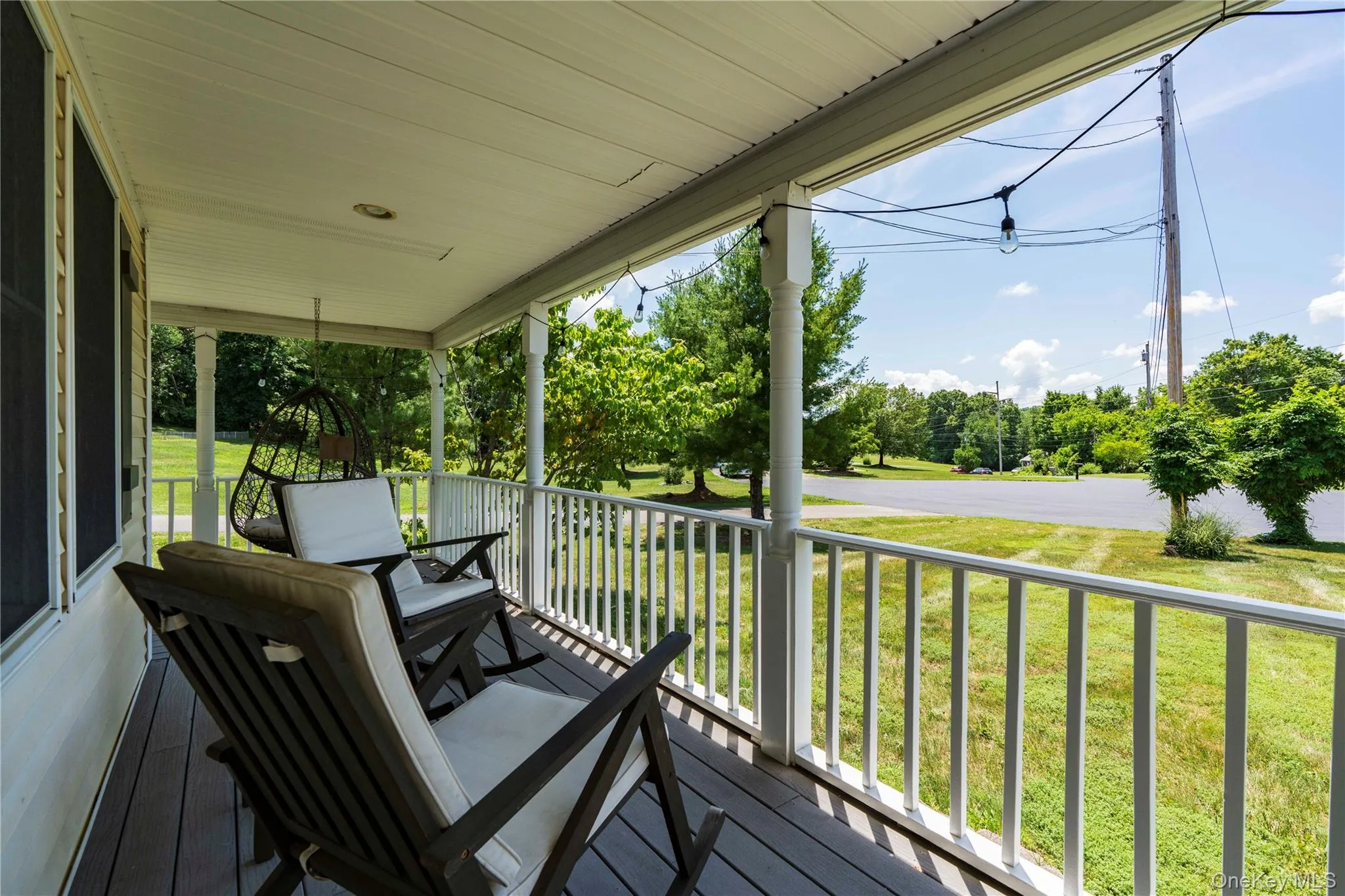 Rocking Chair Front Porch that wraps around the side of the home. Rocking Chair Front Porch that wraps around the side of the home.