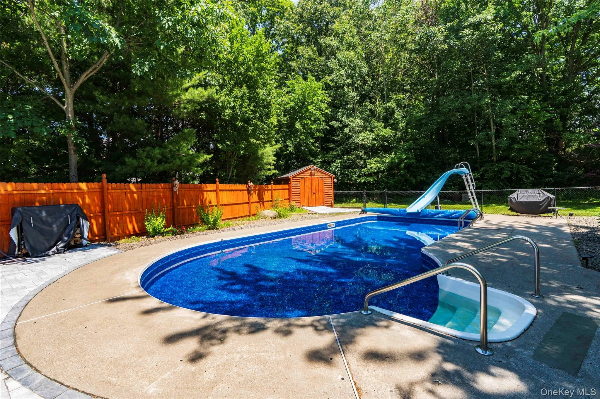 Step into this beautifully landscaped pool Step into this beautifully landscaped pool