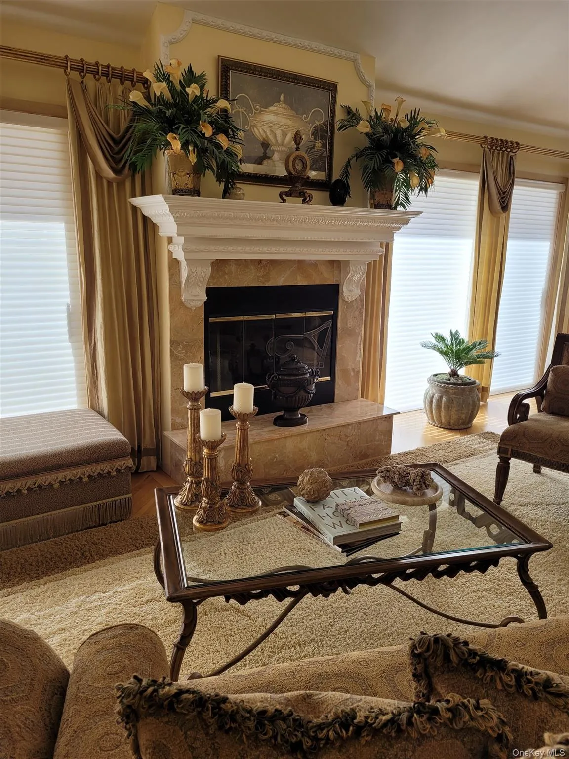 Decorative fireplace with a carved mantel and stone surround Decorative fireplace with a carved mantel and stone surround