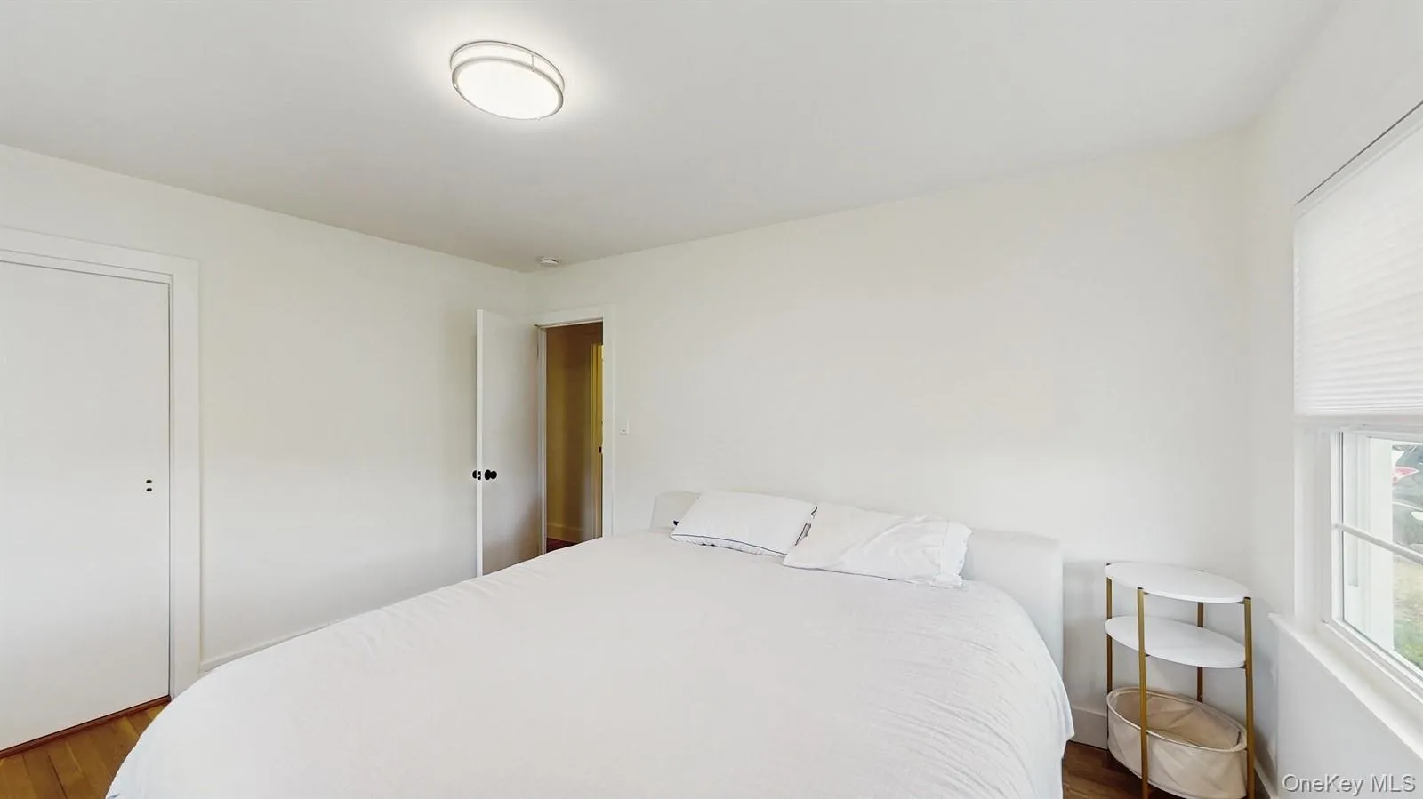 Bedroom with dark wood finished floors Bedroom with dark wood finished floors