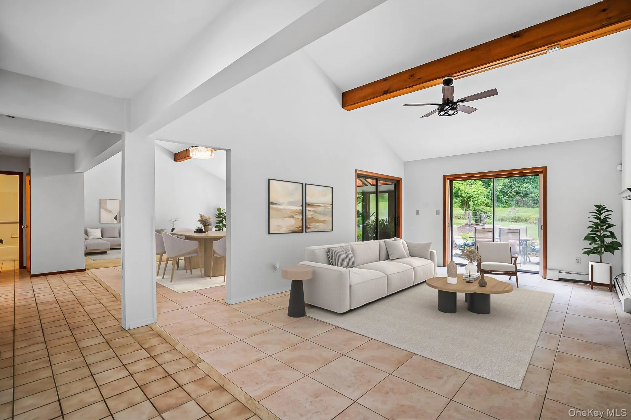 Vaulted ceiling with exposed wood beam and ceiling fan Vaulted ceiling with exposed wood beam and ceiling fan