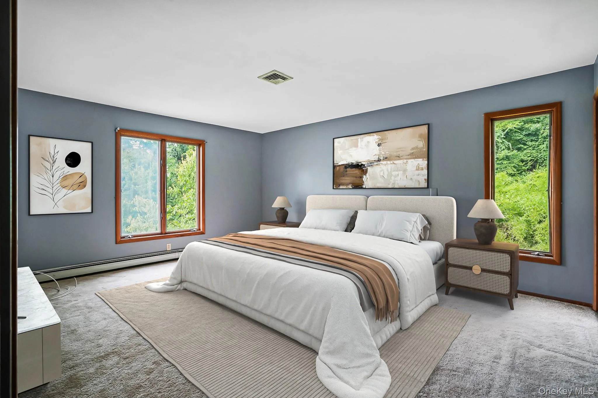 Spacious room featuring gray walls and wood-framed windows Spacious room featuring gray walls and wood-framed windows