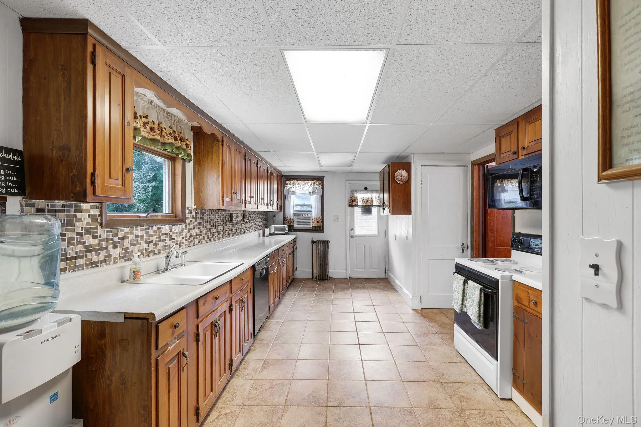 Long kitchen with plenty of counter space. Long kitchen with plenty of counter space.