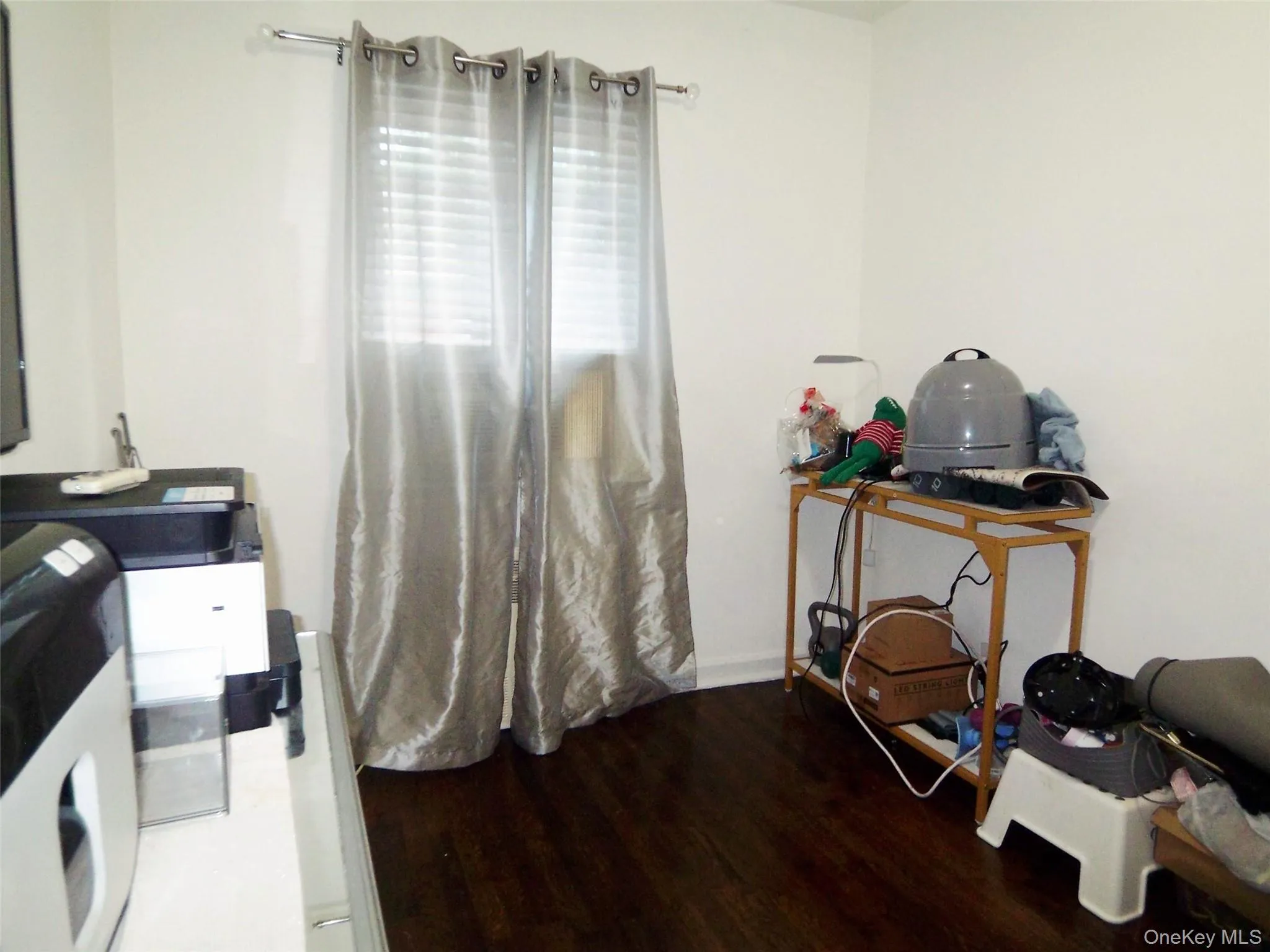 Crisp white walls complement dark wood-finish flooring Crisp white walls complement dark wood-finish flooring
