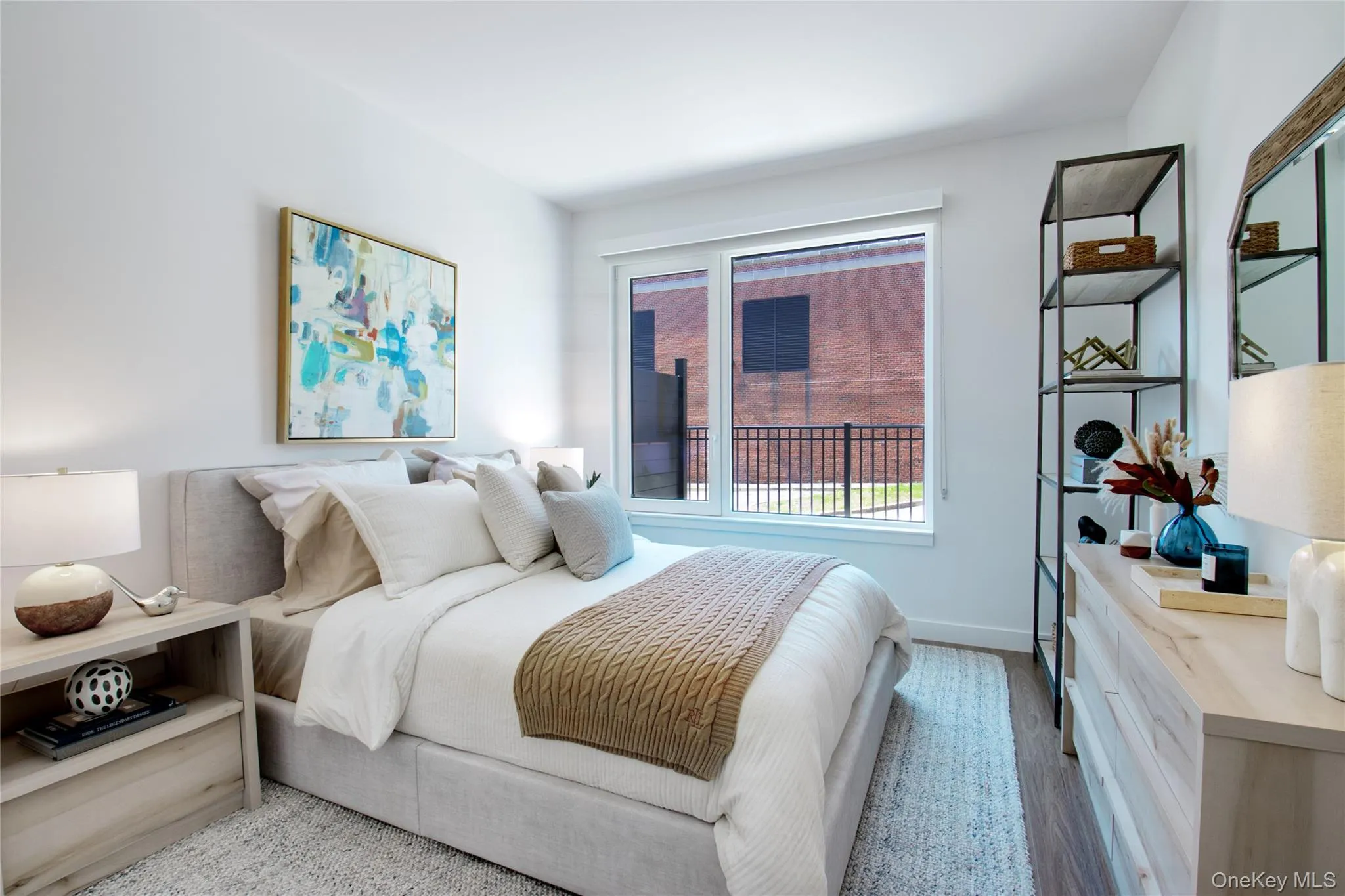 Bedroom featuring baseboards and wood finished floors Bedroom featuring baseboards and wood finished floors
